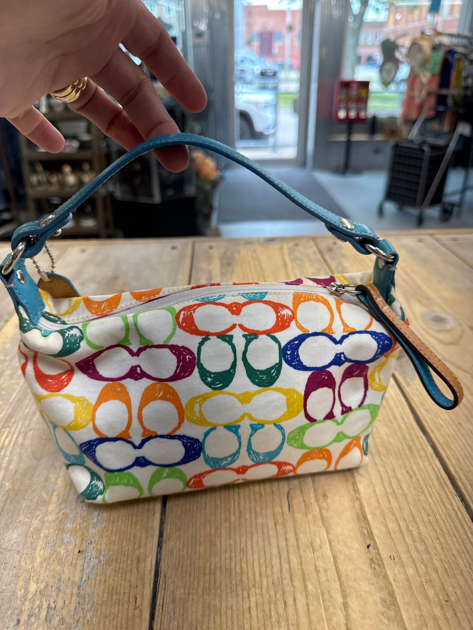 This is a fun Coach multicolor signature wristlet / small pouch in