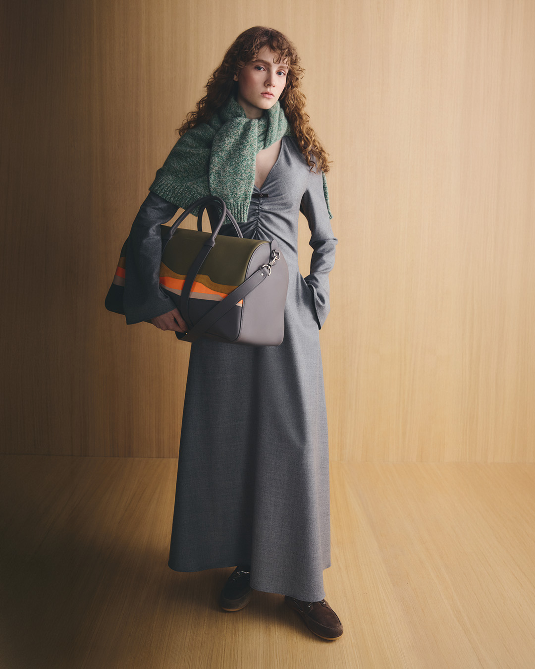 longchamp leather dress X CAROLINE HÉLAIN On the horizon for winter '26 1. The Gray flannel paired with the Longchamp x Caroline Hélain calfskin Daylong travel bag. 2. The soft wool blouse darkgreen