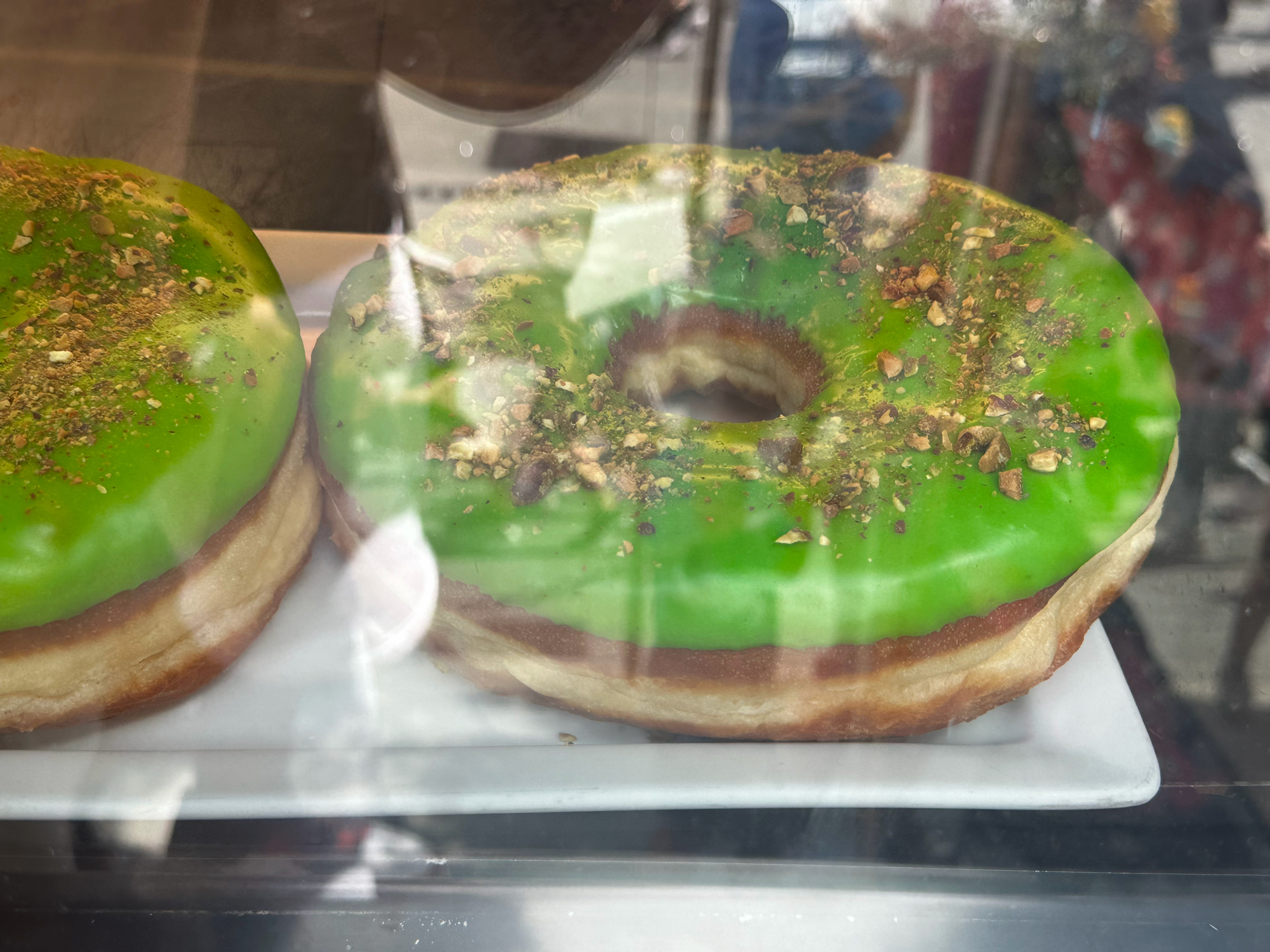 A new Radioactive donut, pistachio cream donut with crushed