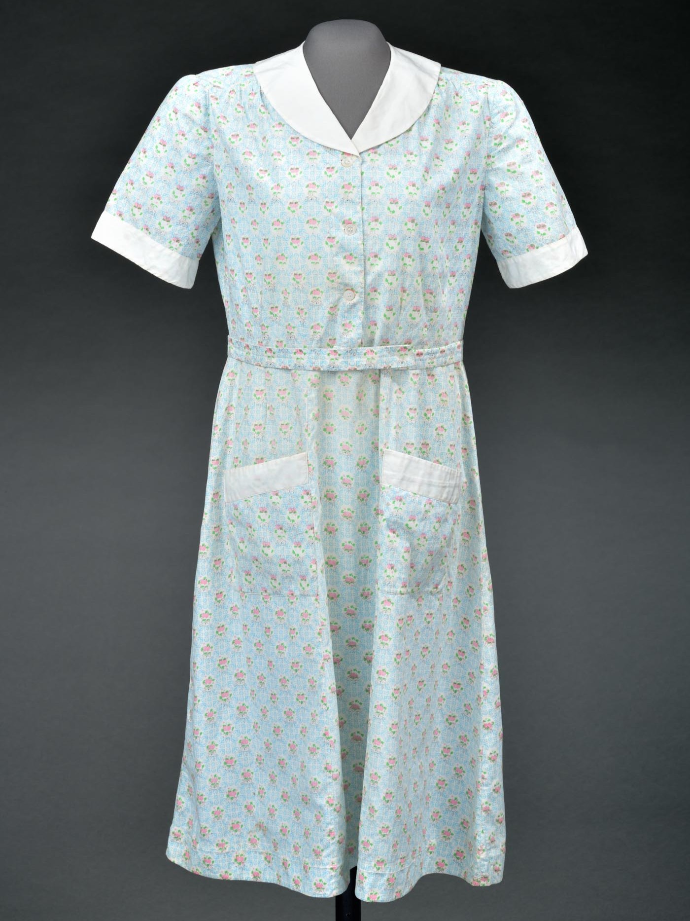 Hank Hanna (1906–1987) of Dunn, a beautician who eventually owned multiple salons across eastern North Carolina, wore today's #TextileTuesday. The pink-and-blue, circa-1935 house dress is constructed of feed sack fabric. Cotton animal