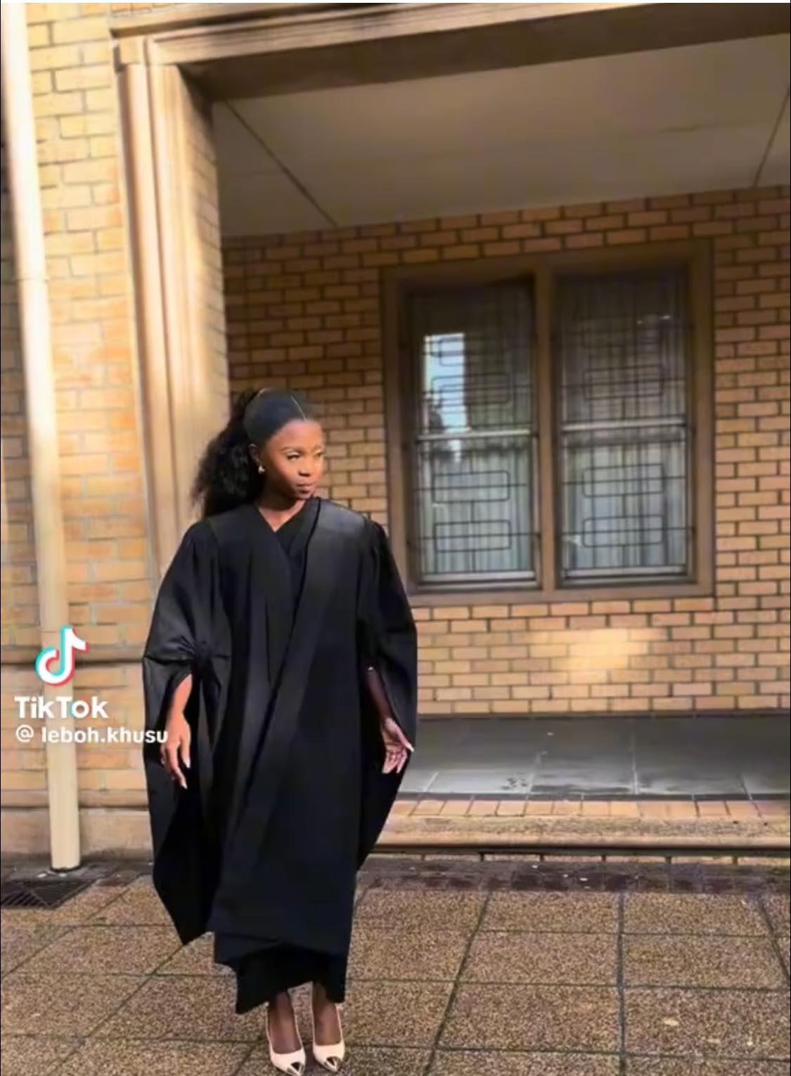 Is a black gown suitable for a policing diploma graduation?