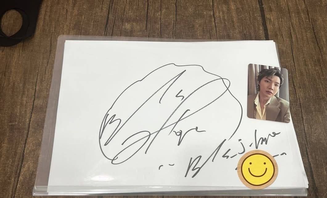 j-hope signs autograph in busan restaurant