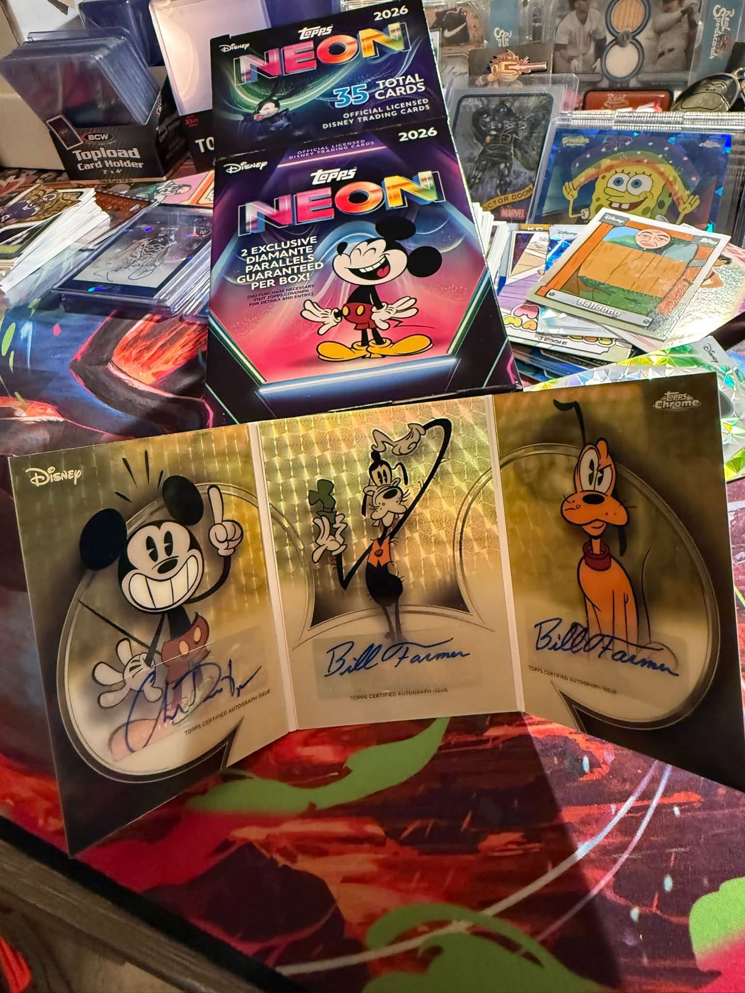 Someone just pulled this absolutely wild Disney triple autograph