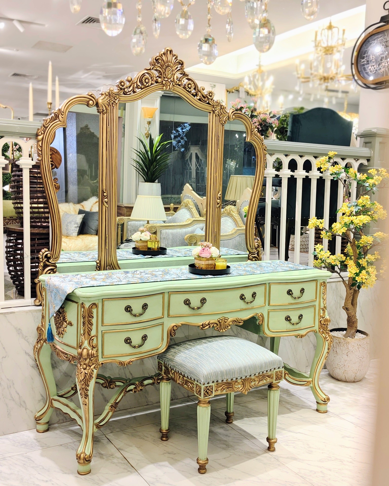 antique gold dressing table Step into timeless elegance with this vintage-inspired table. Featuring soft sage green tones paired with ornate accents, intricate carving, and a tri-fold arched mirror, this vanity brings regal charm and vintage vanity table