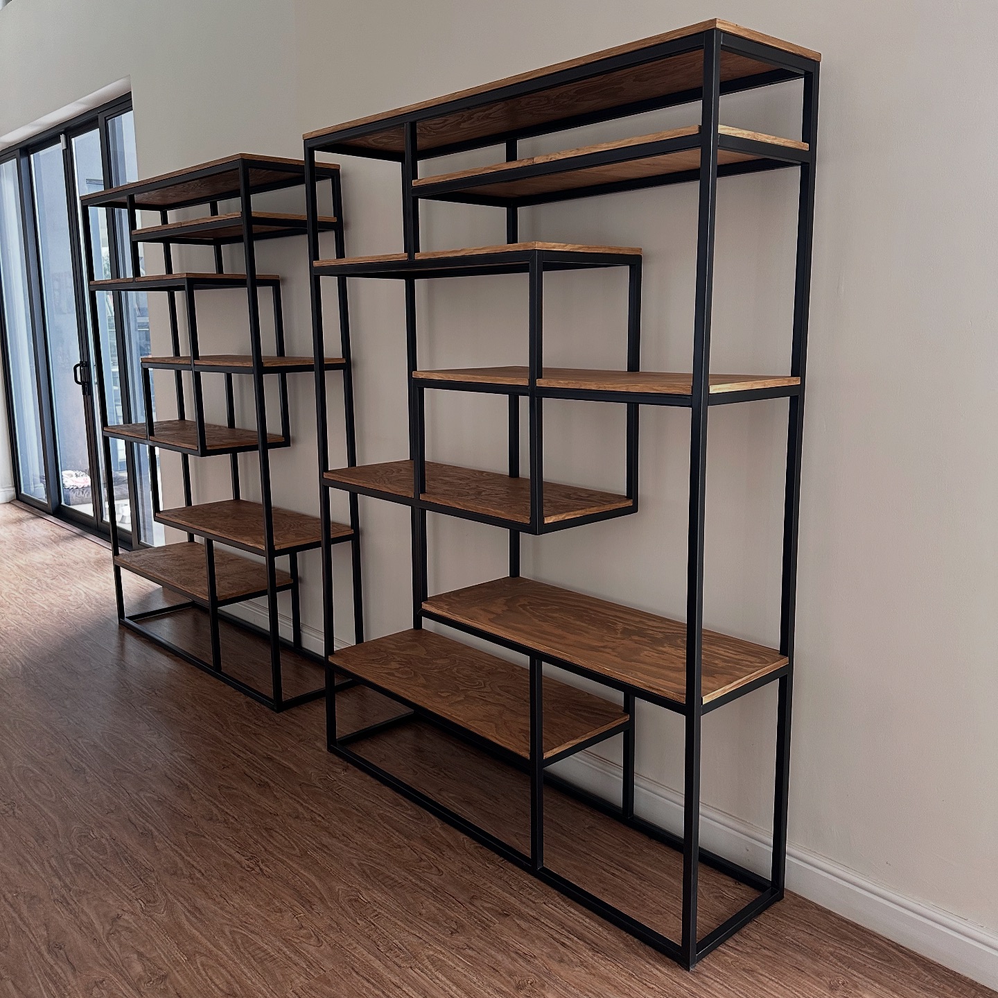 Lyte - Two custom staggered shelving units designed for a... | Facebook