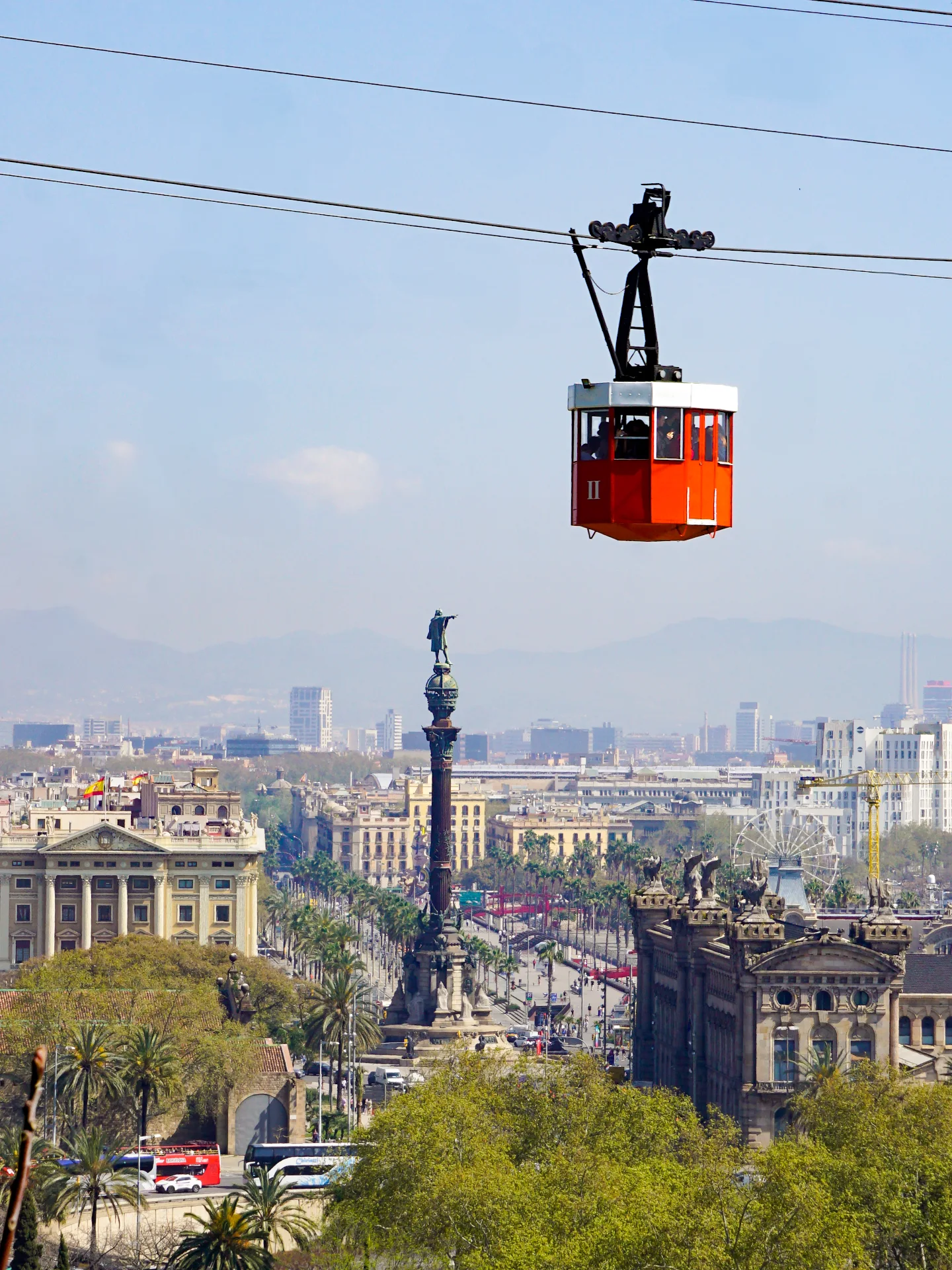 The Monument a Colón behind the Teleférico del Puerto in Barcelona
