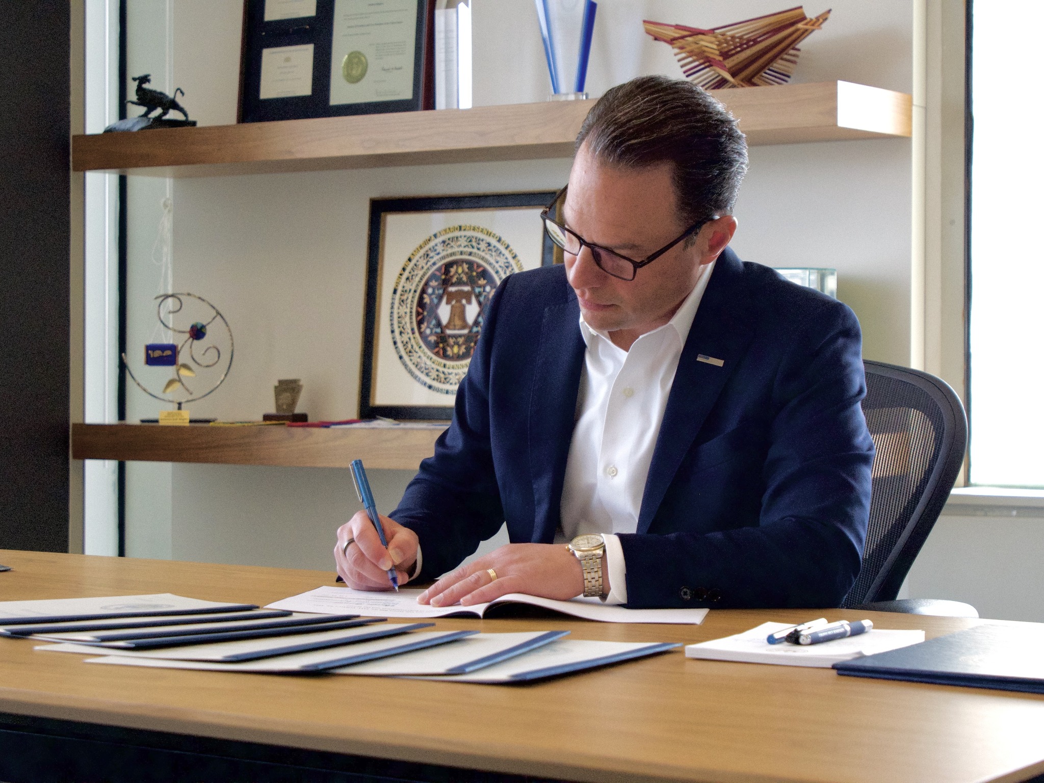 Putting pen to paper as I sign the initial pieces of the 2026-27
