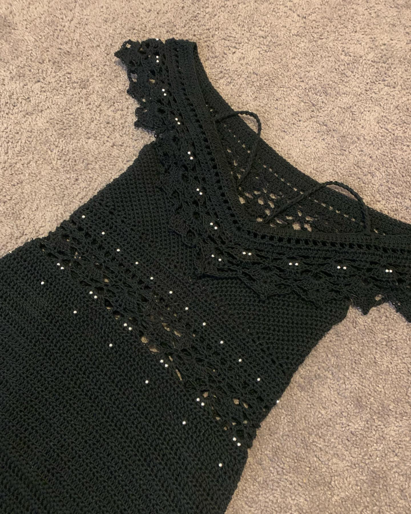 Just finished my very first crochet dress. It was also my first time adding beads to crochet items. I'm so happy with how it turned out. 🖤 ( wisteria dress by spirit