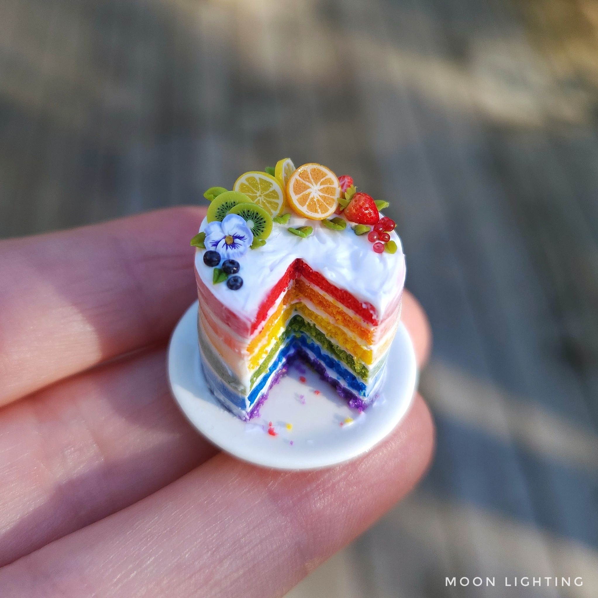 Rainbow Cake with a rainbow of fruit and flowers, make with 