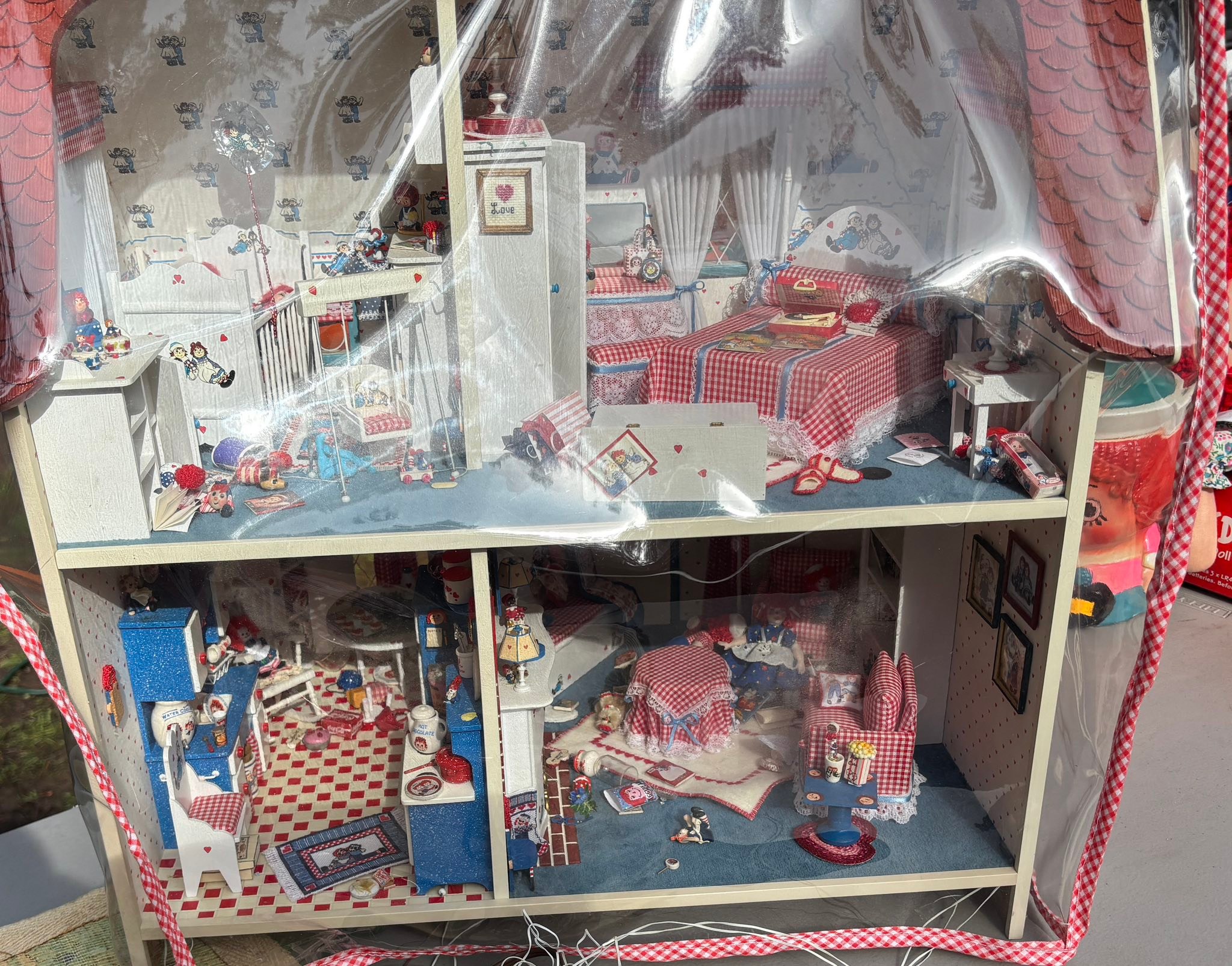 This dollhouse full of Raggedy Ann & Andy miniatures was at the