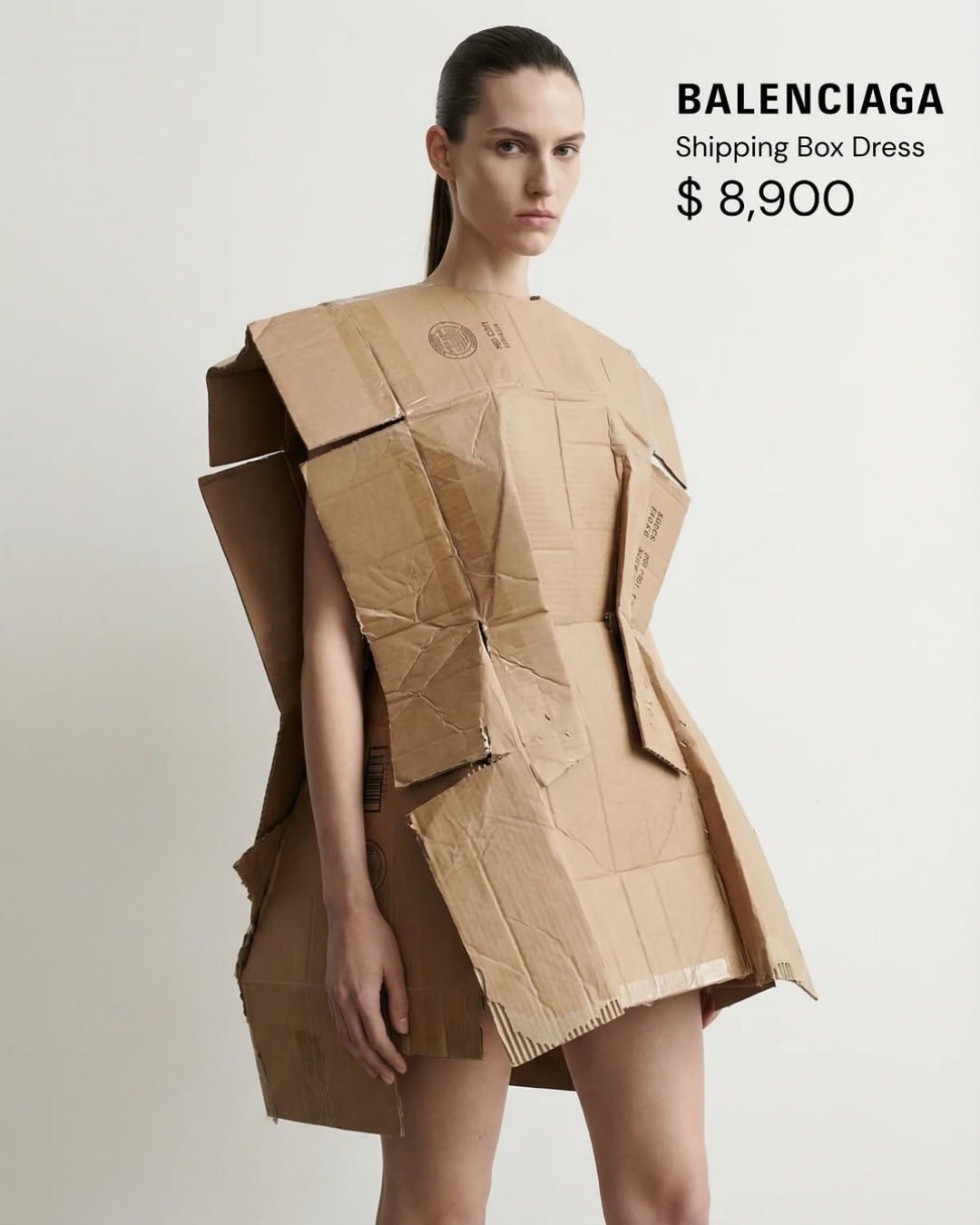 balenciaga dress just took “thinking outside the box” to a whole new level… literally. This $8,900 cardboard-inspired is turning heads, sparking debates, and once again proving that in fashion, shock value sells colour:BLUE FLORAL PRINT lx-WDRS543 Cut Out Dresses – Draped cowl back