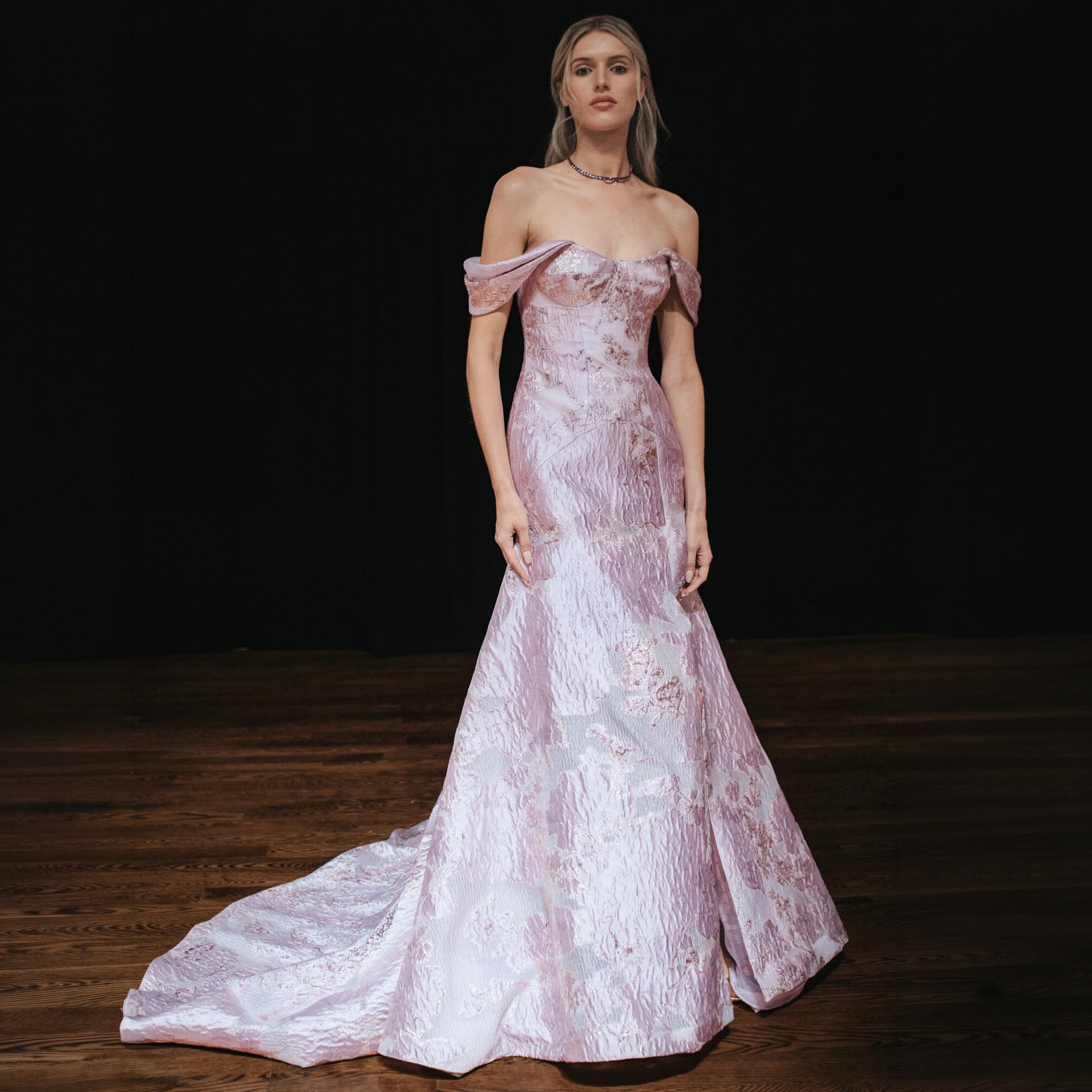 Lilac fil-coupé woven with metallic rose gold threads lends a soft radiance to our draped shoulder gown. Discover our latest collection at pamellaroland.com Jewelry: Chopard Official Makeup: Academy of Freelance Makeup Makeup