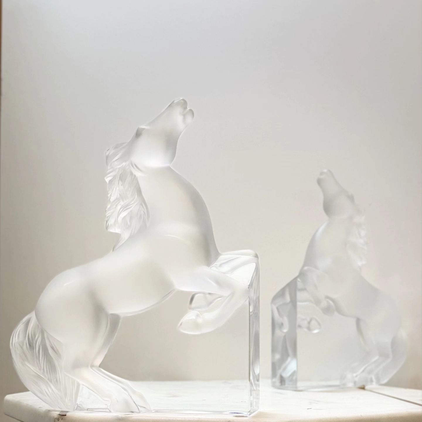 Lalique Kazak Horse sculptures in frosted crystal, capturing