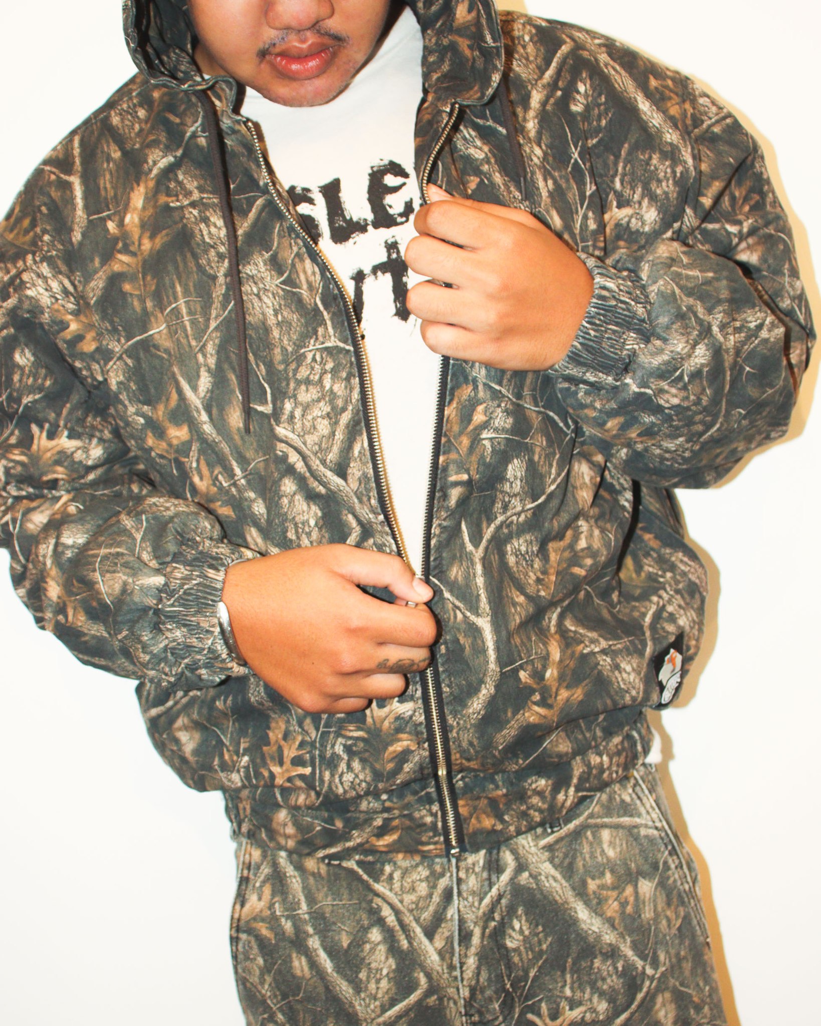 Butter Goods forest camo work jacket and shorts, made with 100 