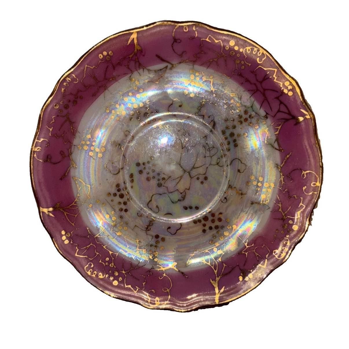 This vintage porcelain saucer from Japan exudes a nostalgic charm