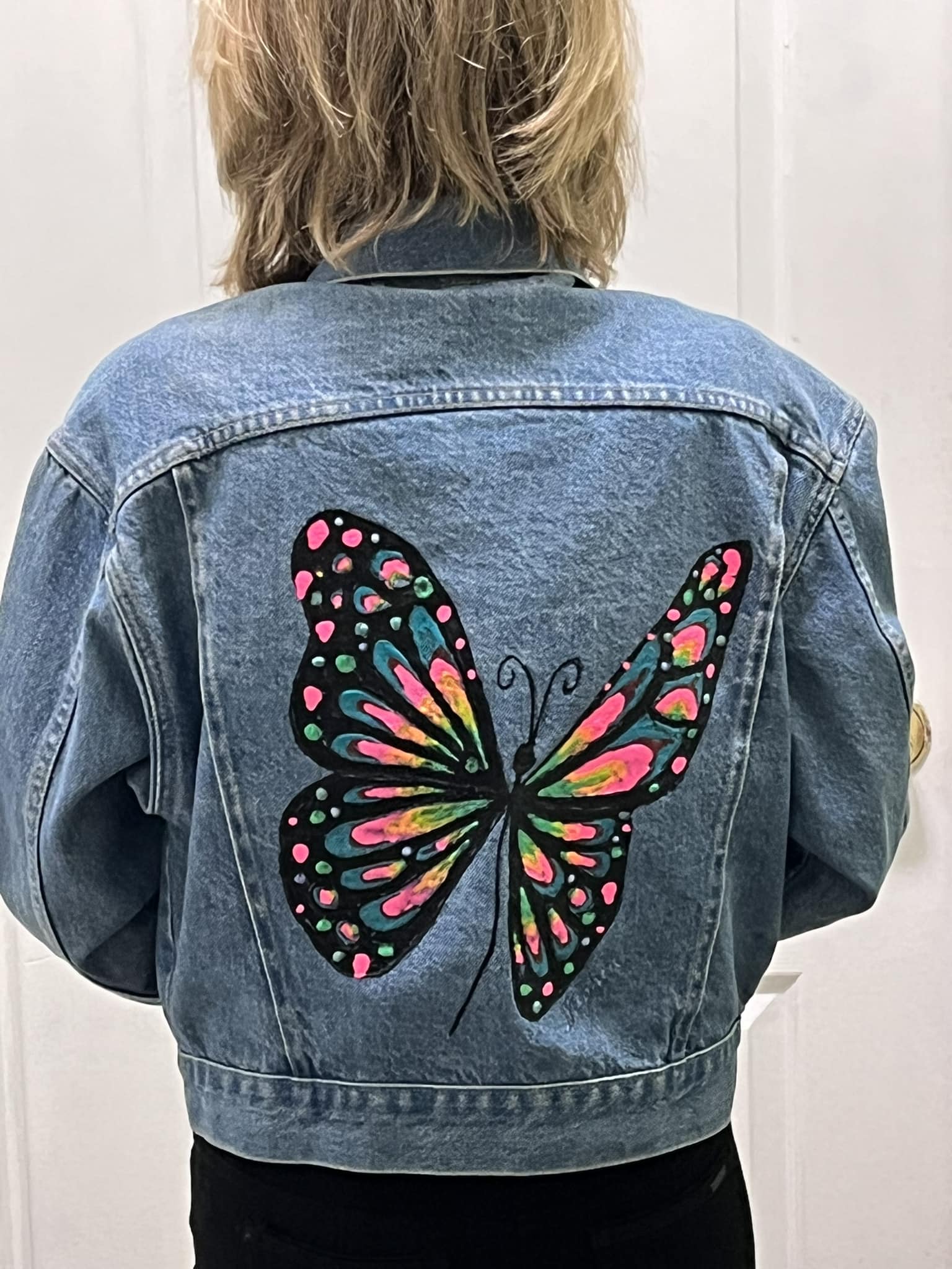 Acrylic butterfly painting on old denim jacket