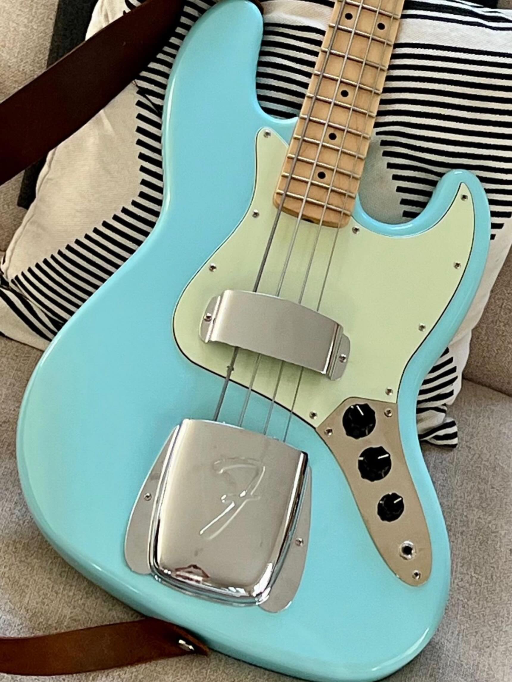 What is the difference between a Squier and Fender JB-355 Jazz Bass?