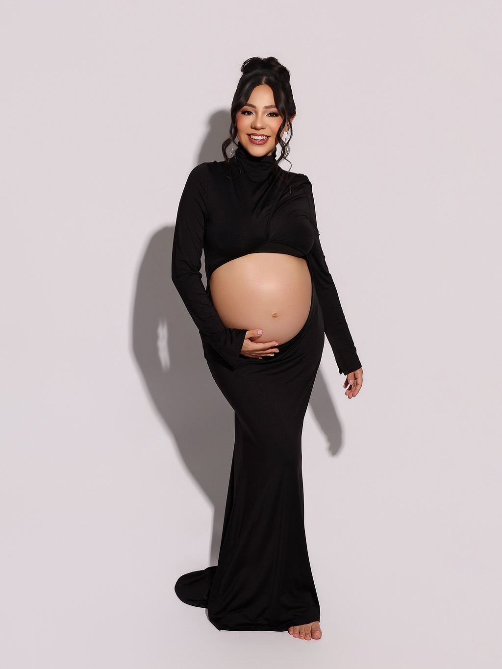 black maternity dress photoshoot Maternity, but make it fashion. 🖤🔥 Because growing a whole human doesn't mean we're giving up the main character energy. 😮‍💨 Clean. Bold. A little attitude. Exactly how I like it. HMUA design Asymmetrical Waist Rouched Maxi Black lace maternity COLOR:SMOKE/SILVER Silhouette made to accommodate