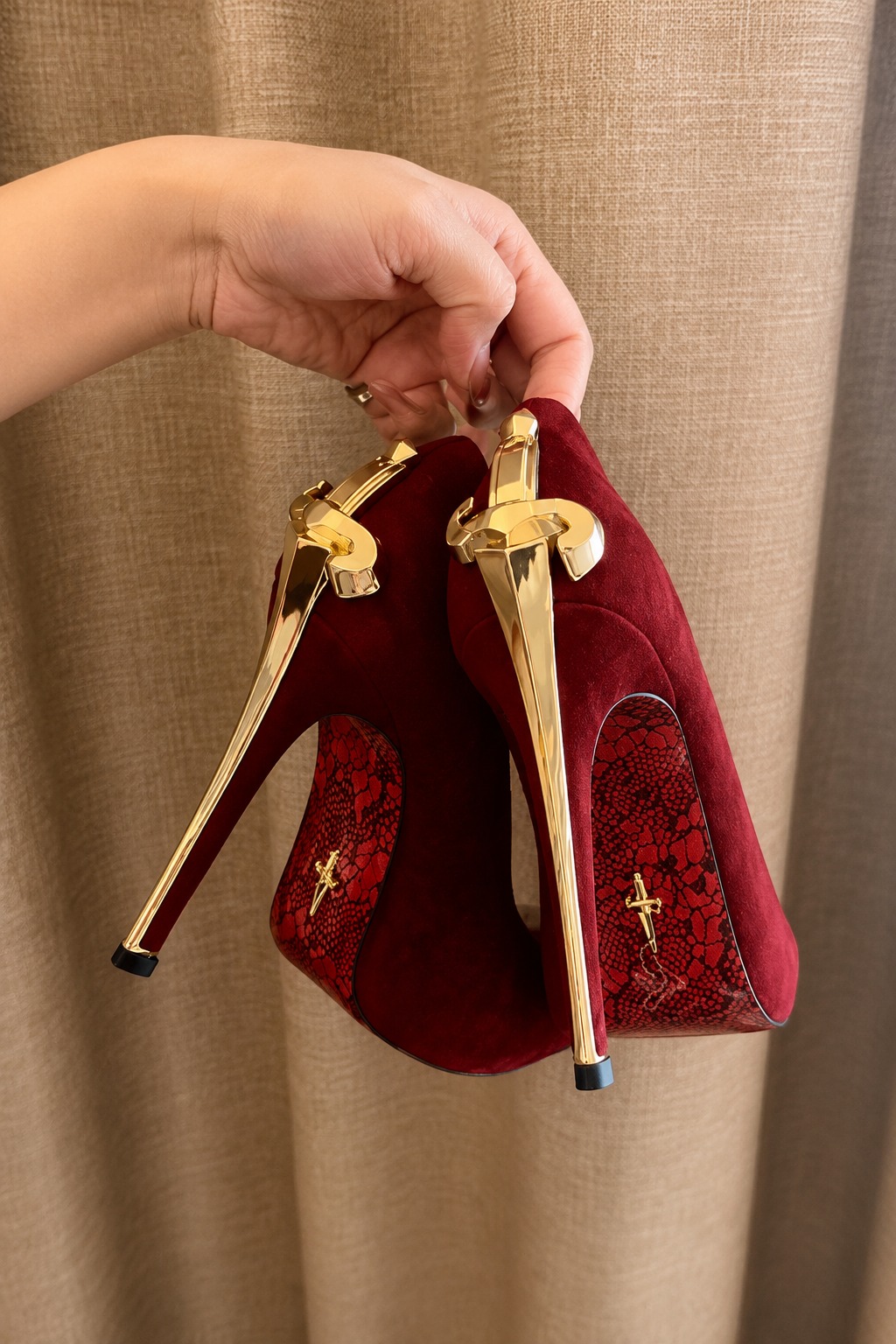 Red velvet Giuseppe Zanotti stilettos with gold heels bring rich color and dramatic luxury. Wear them with a fitted black dress and minimal gold jewelry. #GiuseppeZanotti #RedHeels #LuxuryFashion