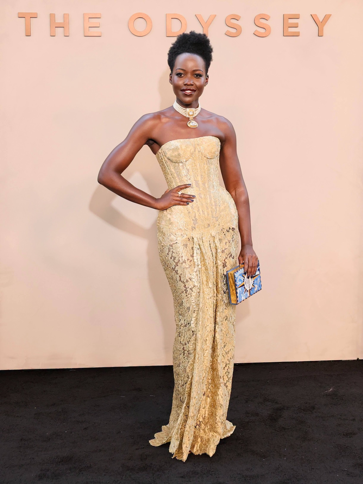 Lupita looks absolutely stunning on the NYC red carpet premiere of “The Odyssey.” That melanin is 🔥
