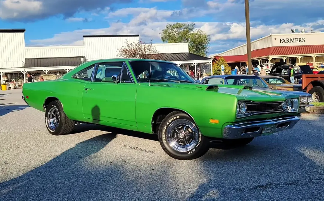 1969 Dodge Super Bee green classic at car show