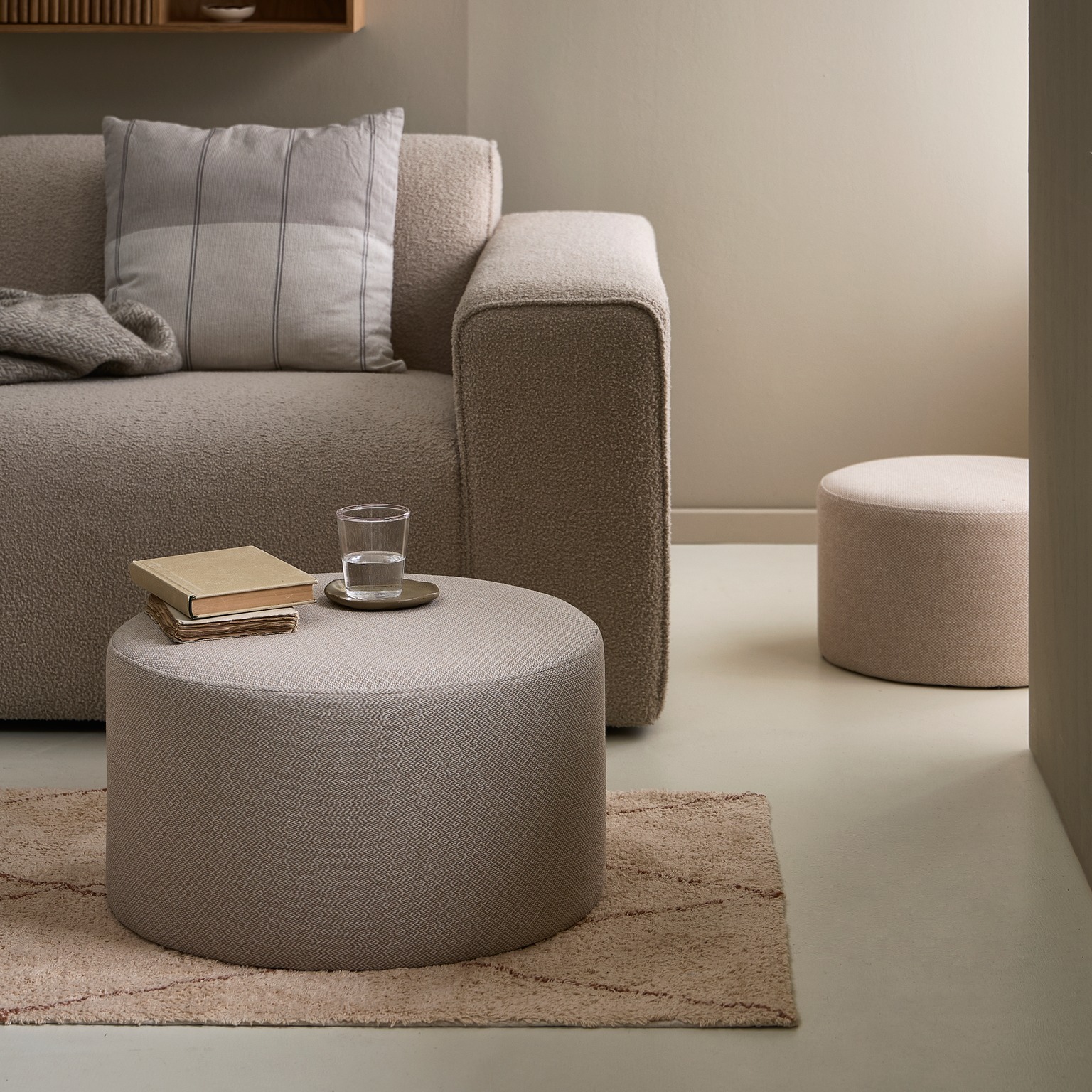 Exclusively online 🤎 The sisters' pouf offers a soft extra seat wherever it is needed, whether placed beside the sofa or in a quiet corner. Pouffe, £37.90 Discover more furniture in the