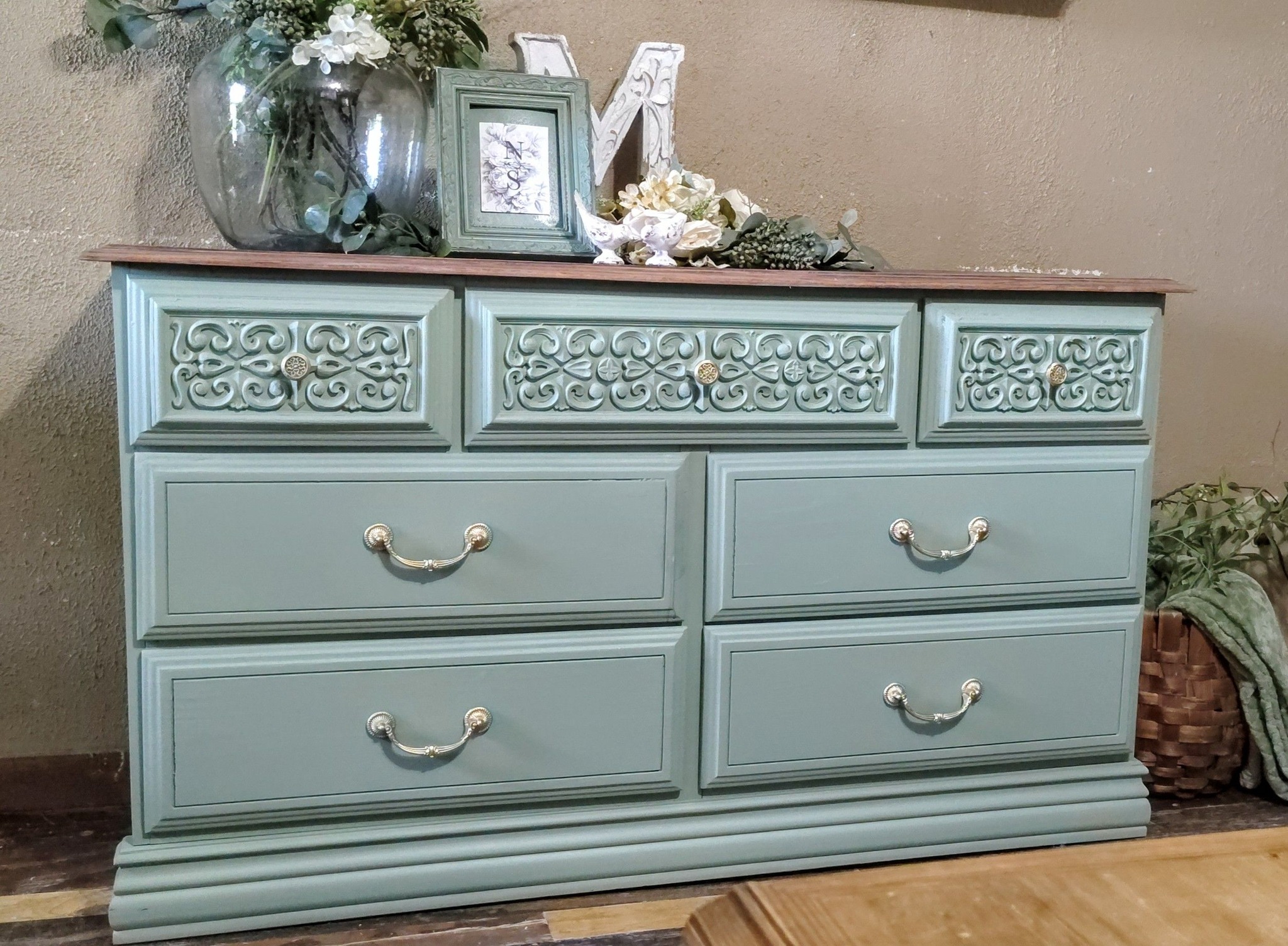 Refurbished dresser with sage green color and gold accents