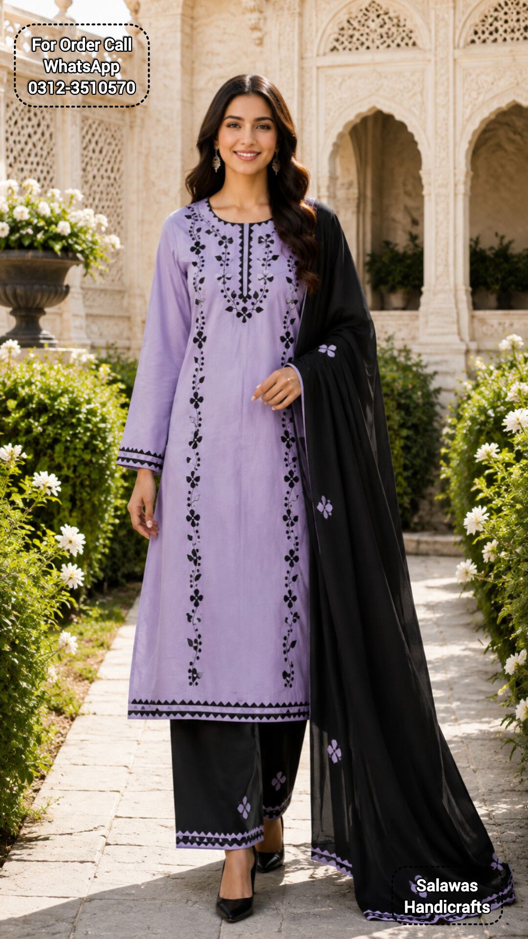 A full-length fashion photograph of a handcrafted appliqué embroidery dress displayed on a sleek mannequin against a neutral, warm-toned backdrop. Soft overhead studio lighting accents the raised texture, fine needlecraft, and vibrant