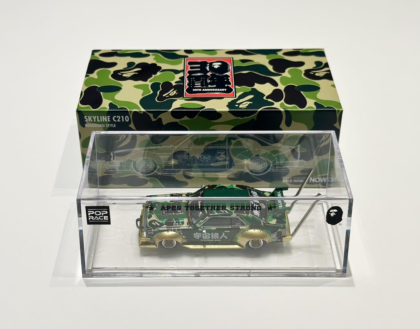 New in Stock 1/64th BAPE® × POPRACE collaboration pays homage to