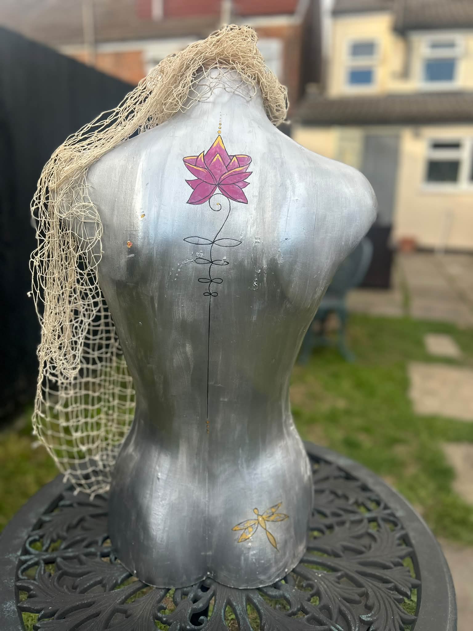 Upcycled mannequin art project using mixed media acrylic and pen