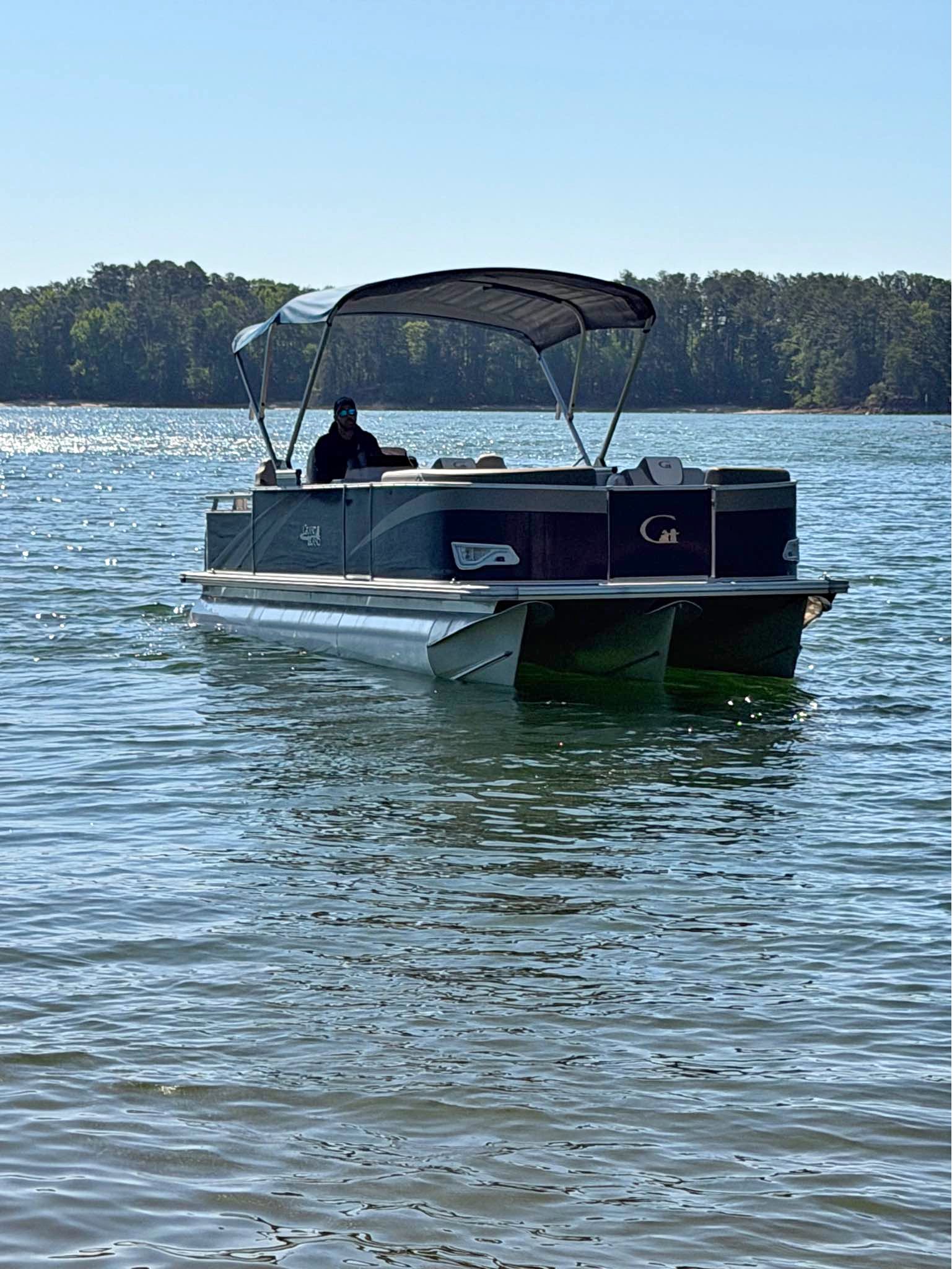 24 foot tritoon custom built 150 horse power 2 stroke mercury. Sets on ...