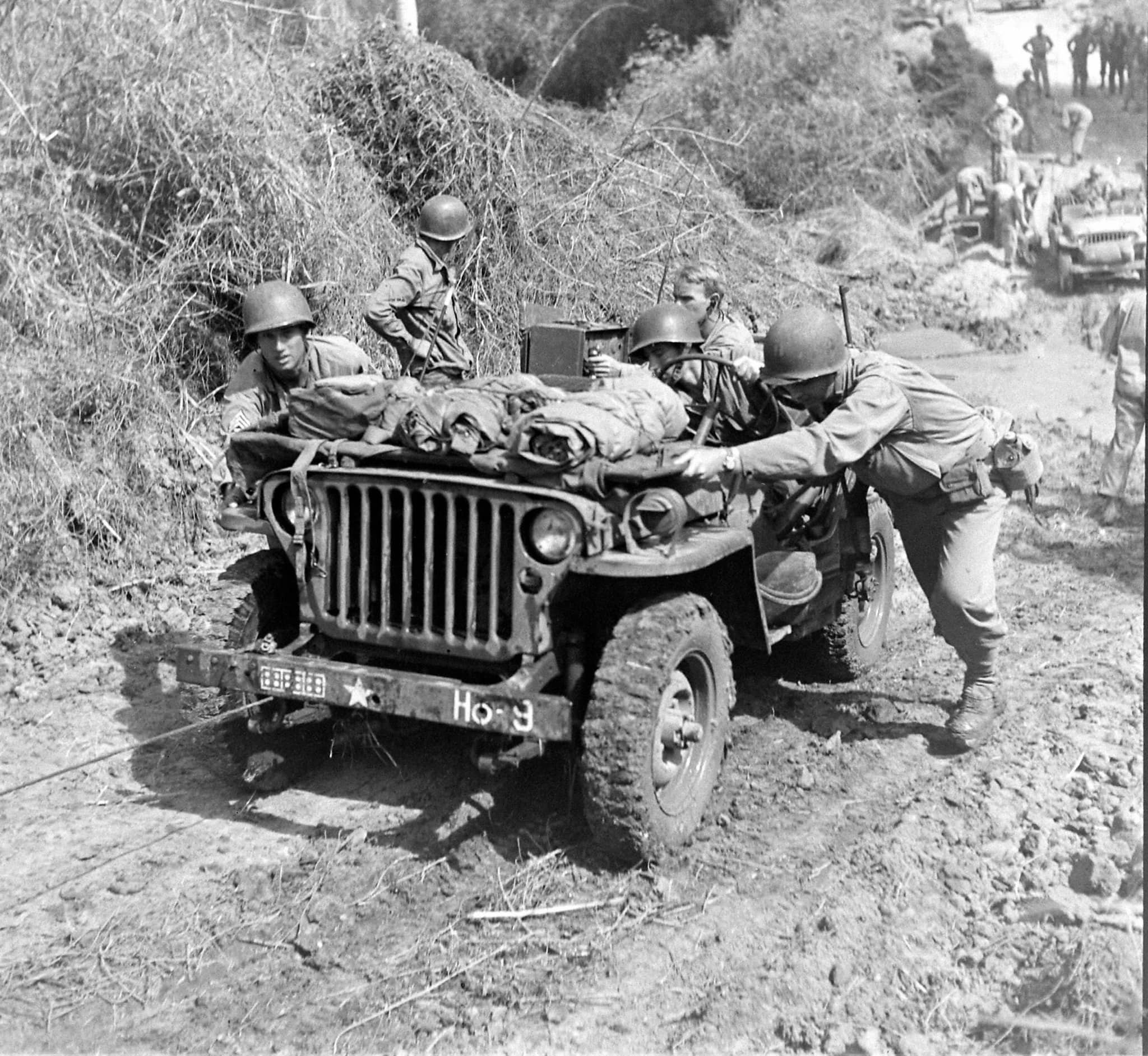 US Jeeps cross a muddy ravine near... - World War Pictures | Facebook