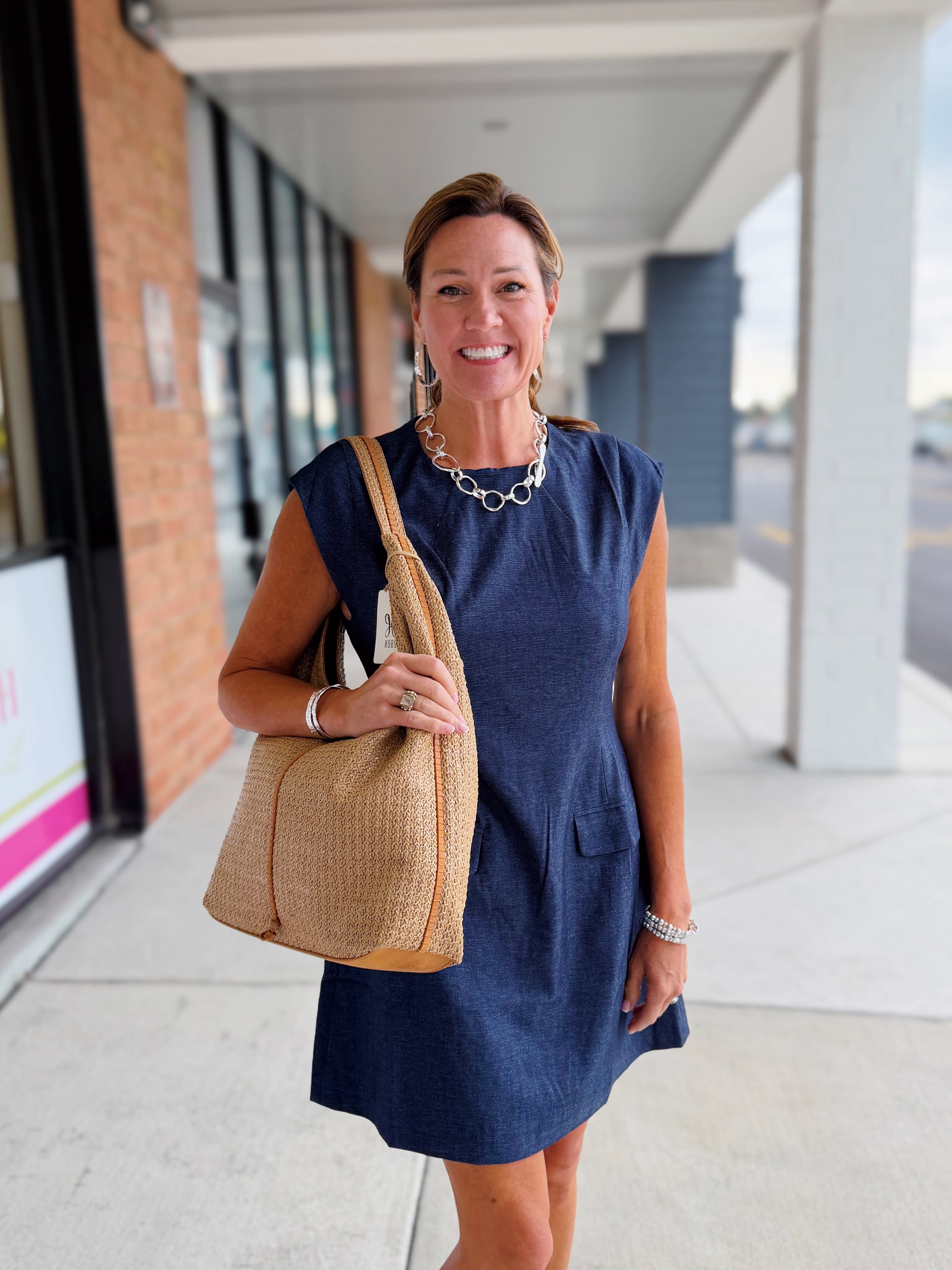 Catherine wears thml denim dress with leslie curtis jewelry