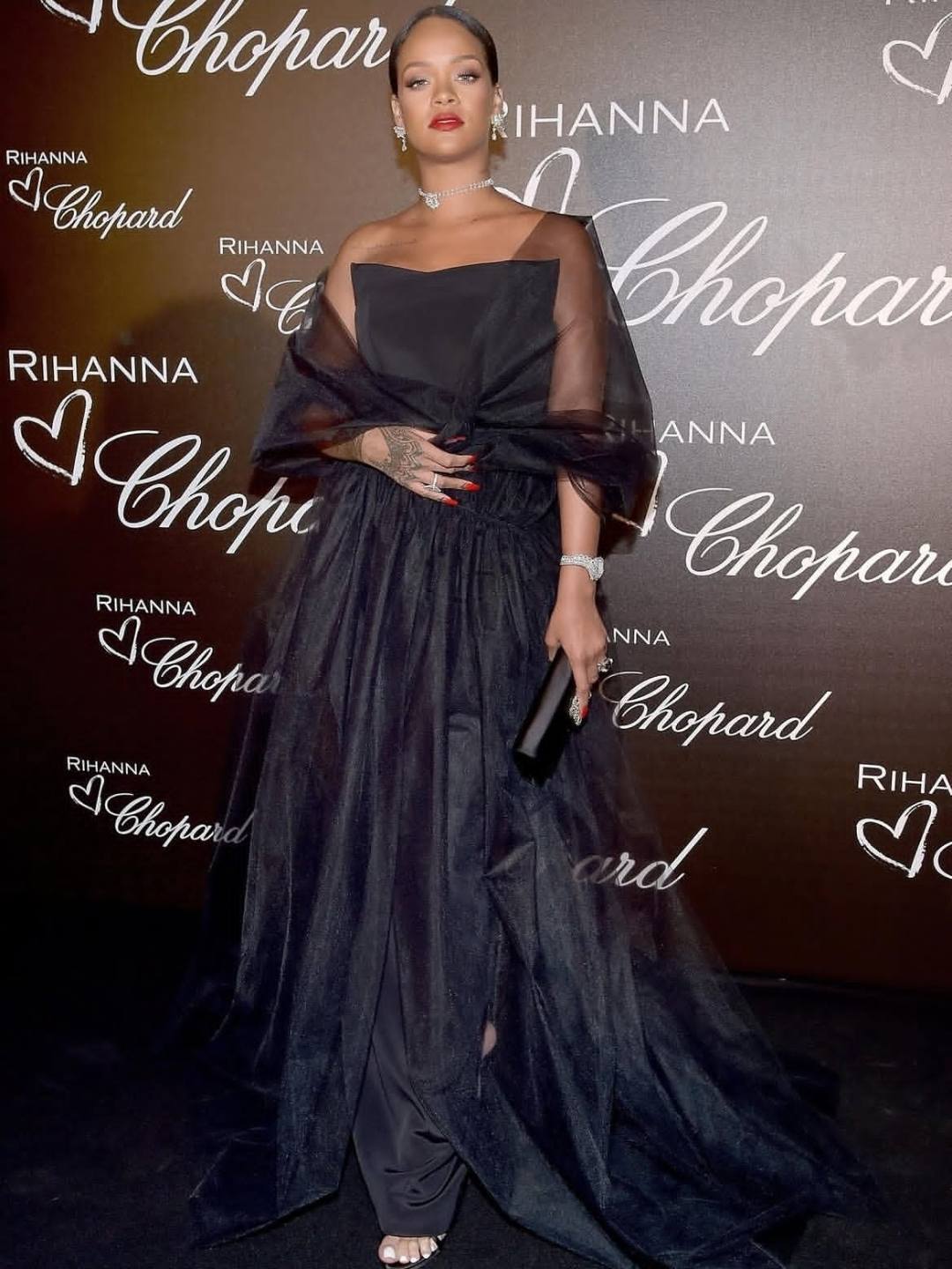 black dress rihanna attended dinner hosted by Chopard during the 70th Cannes Film Festival. She looked stunning in this tulle gown by Ralph and Russo along with exquisite jewelry to give a signature rihanna outfits