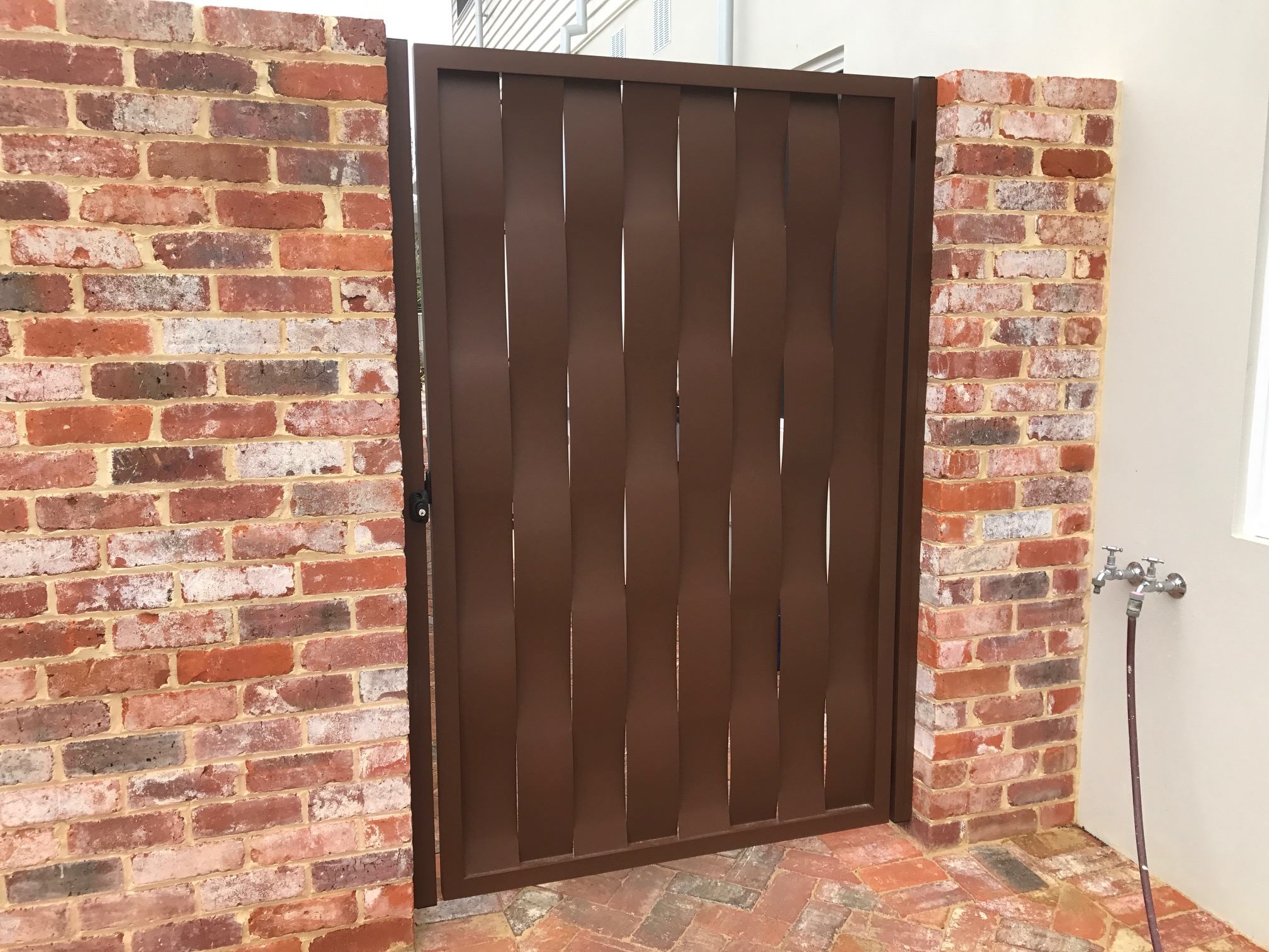 A wavy rusted styled gate ~ ~ - Customised Metal Works