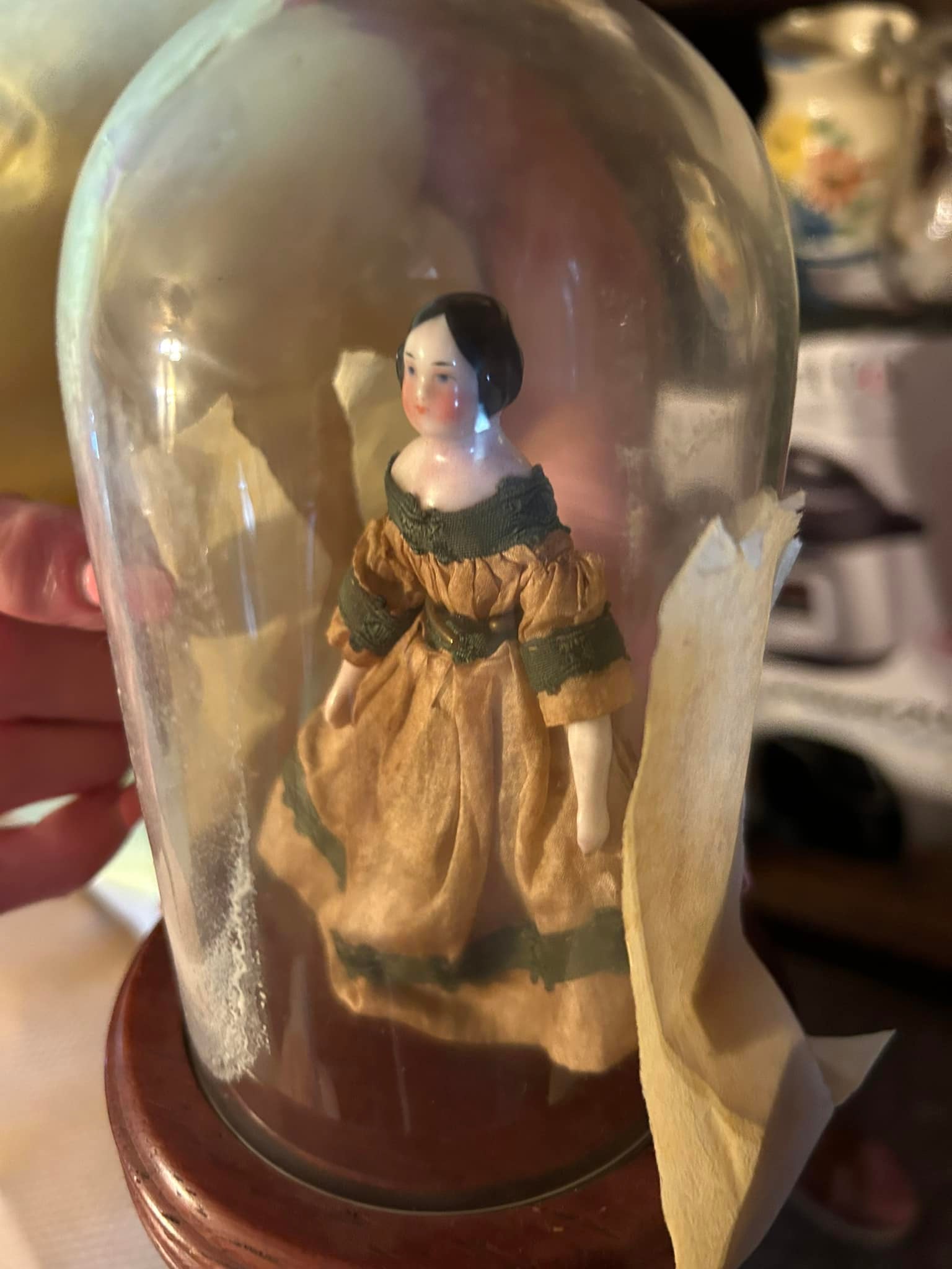 What is the value and origin of this antique China doll from the