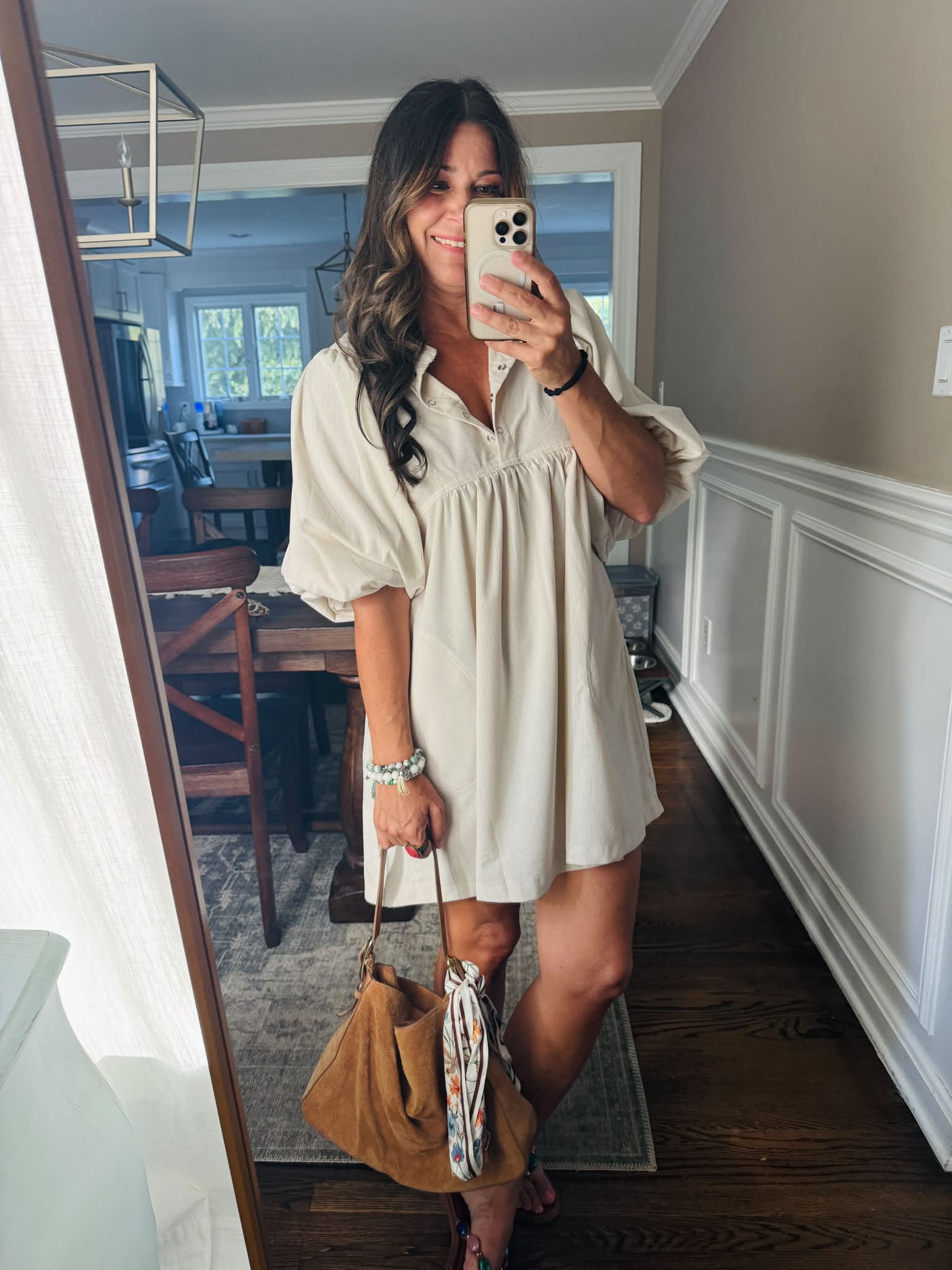 neutral flowy dress Top seller yesterday!!! This babydoll mini has the prettiest fit with statement sleeves, and I love it paired with a suede tote + scarf for a little texture. It's the Wedding guests