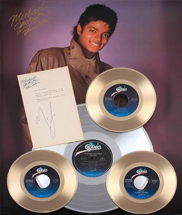 Michael Jackson with Thriller 25 plaque