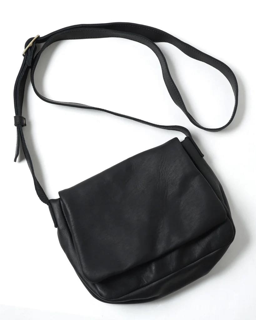 Tenon flap shoulder bag and helmet bag prices