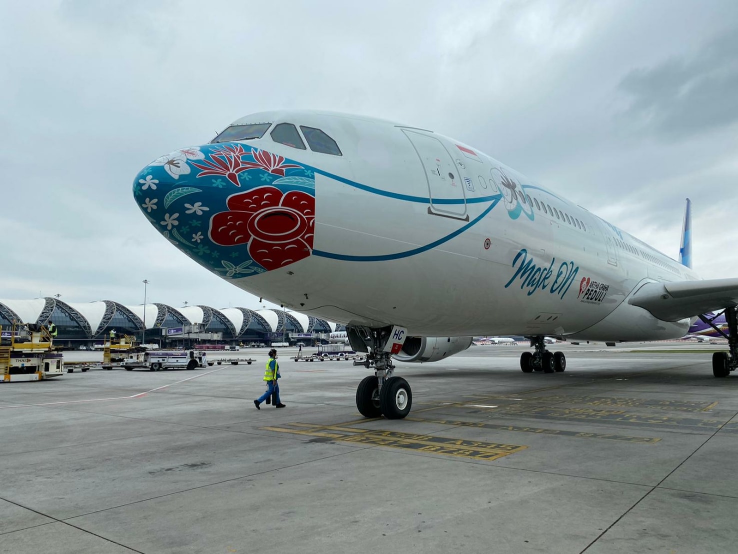 An airplane with a mask has arrived at Suvarnabhumi Airport