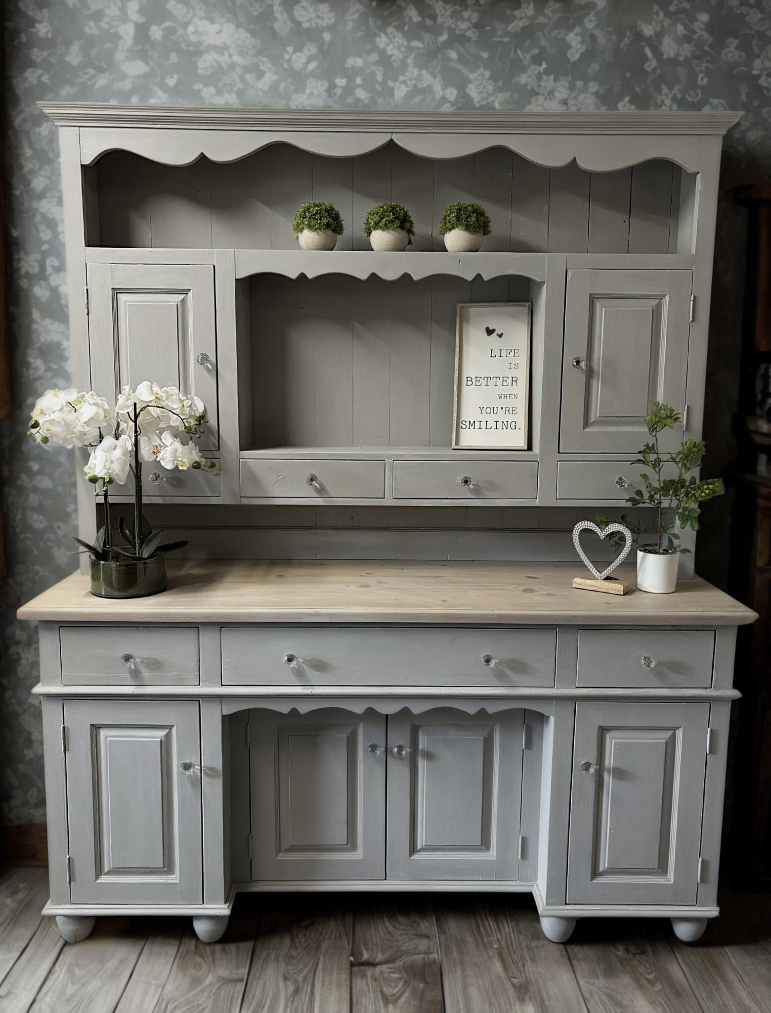 A Welsh dresser masterfully painted in heavily distressed chalk paint, with a natural wood top. Beautiful finish all over