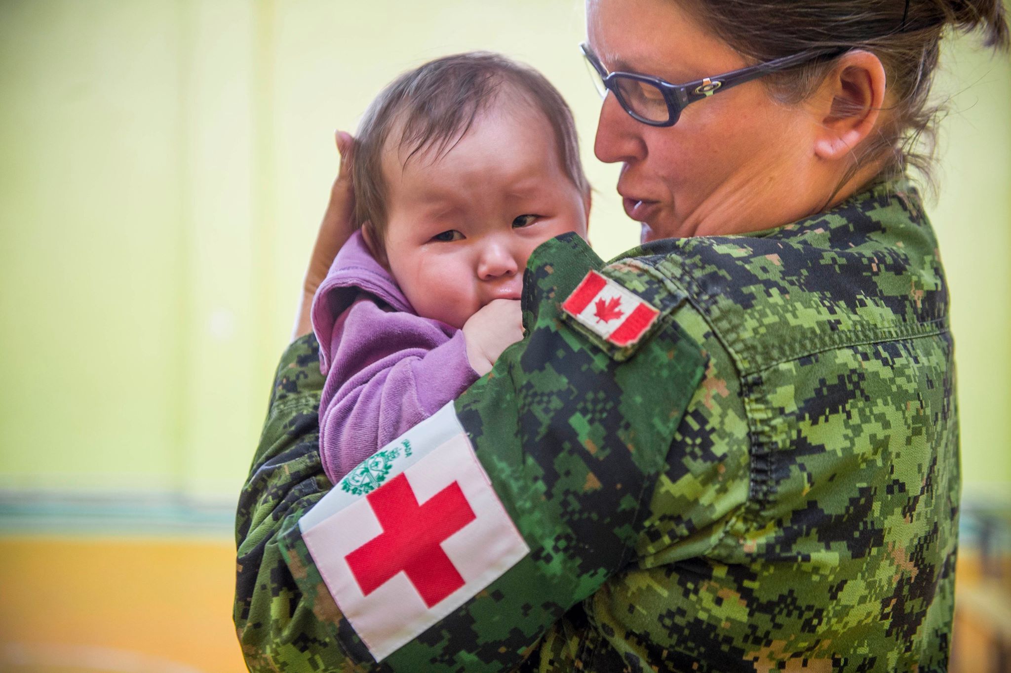 Canadian Armed Forces - Master Corporal Anne Vallieres calms a crying ...