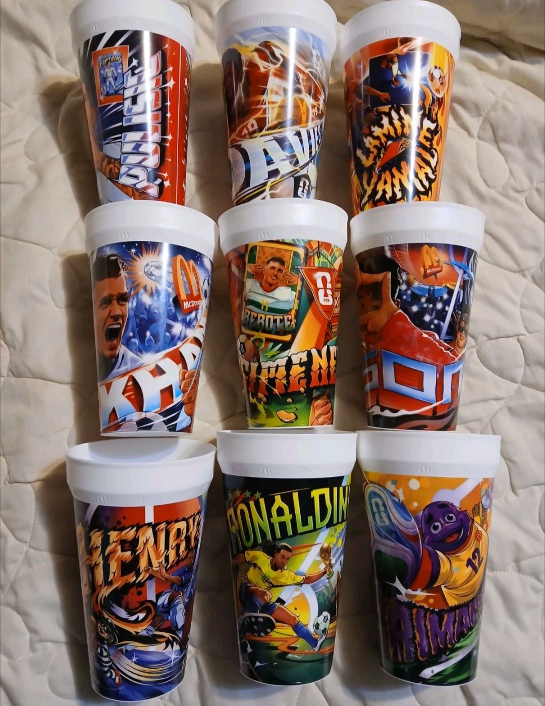 The McDonald's cups feature Christian Pulisic, Ronaldinho Gaucho