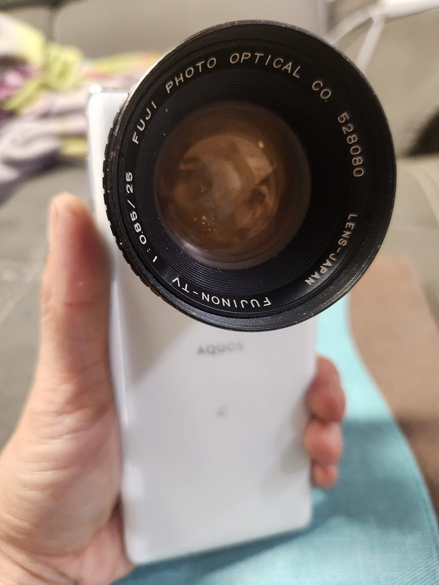 Fujinon 25mm f/0.85 C-mount lens on phone