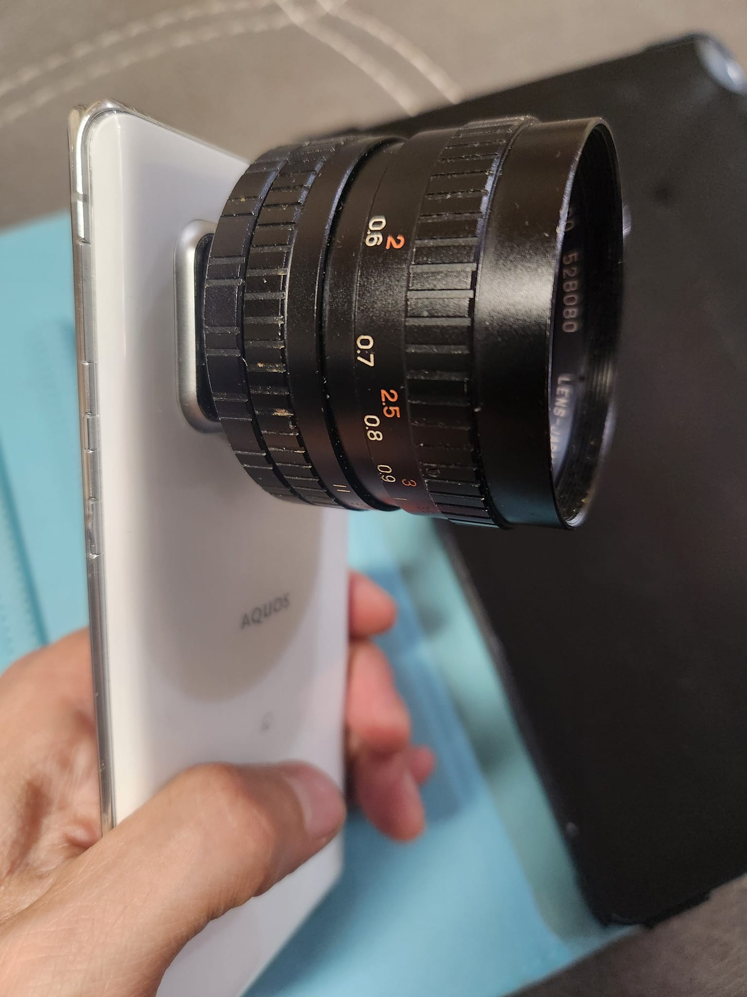 Fujinon 25mm f/0.85 C-mount lens on phone