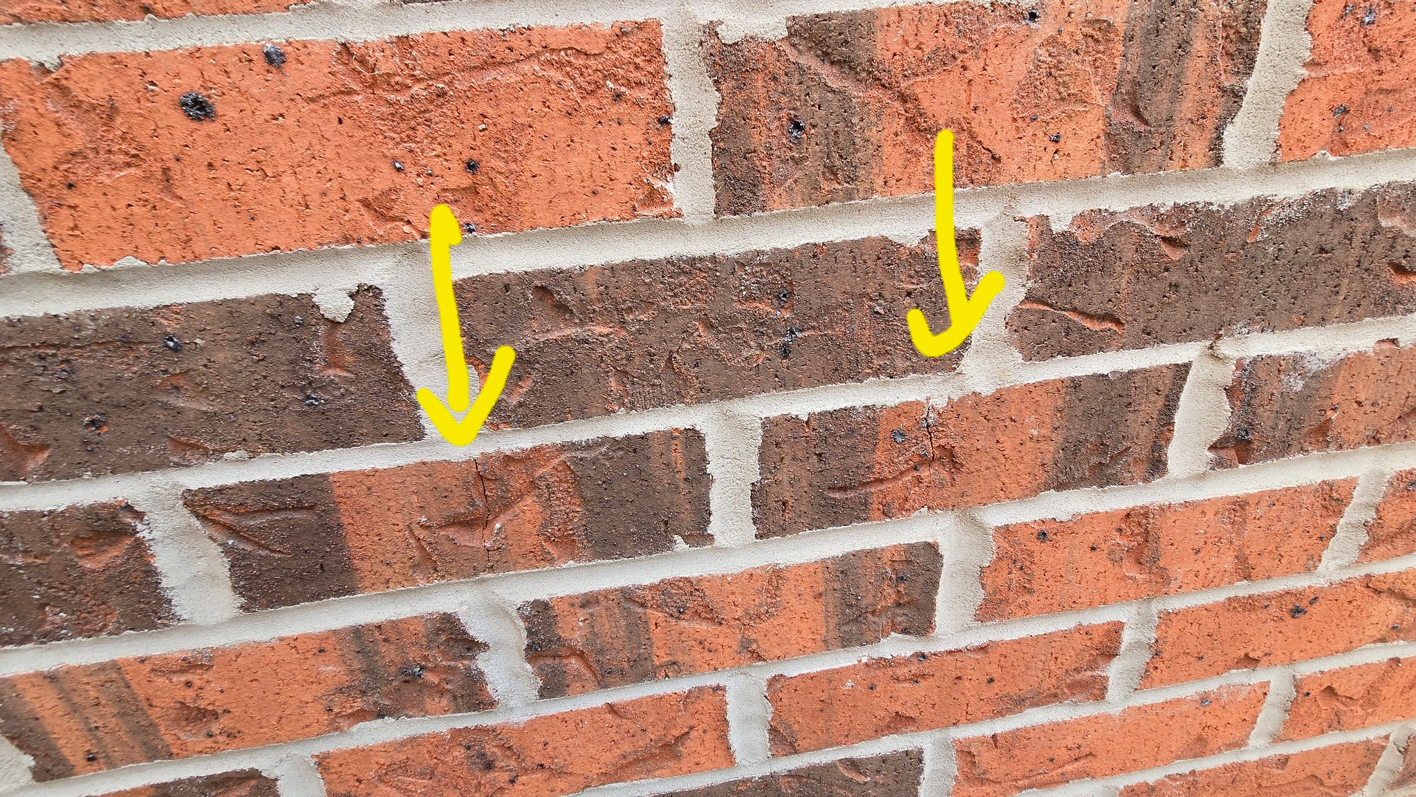I am buying this new house. Found 5 small cracks in brick around