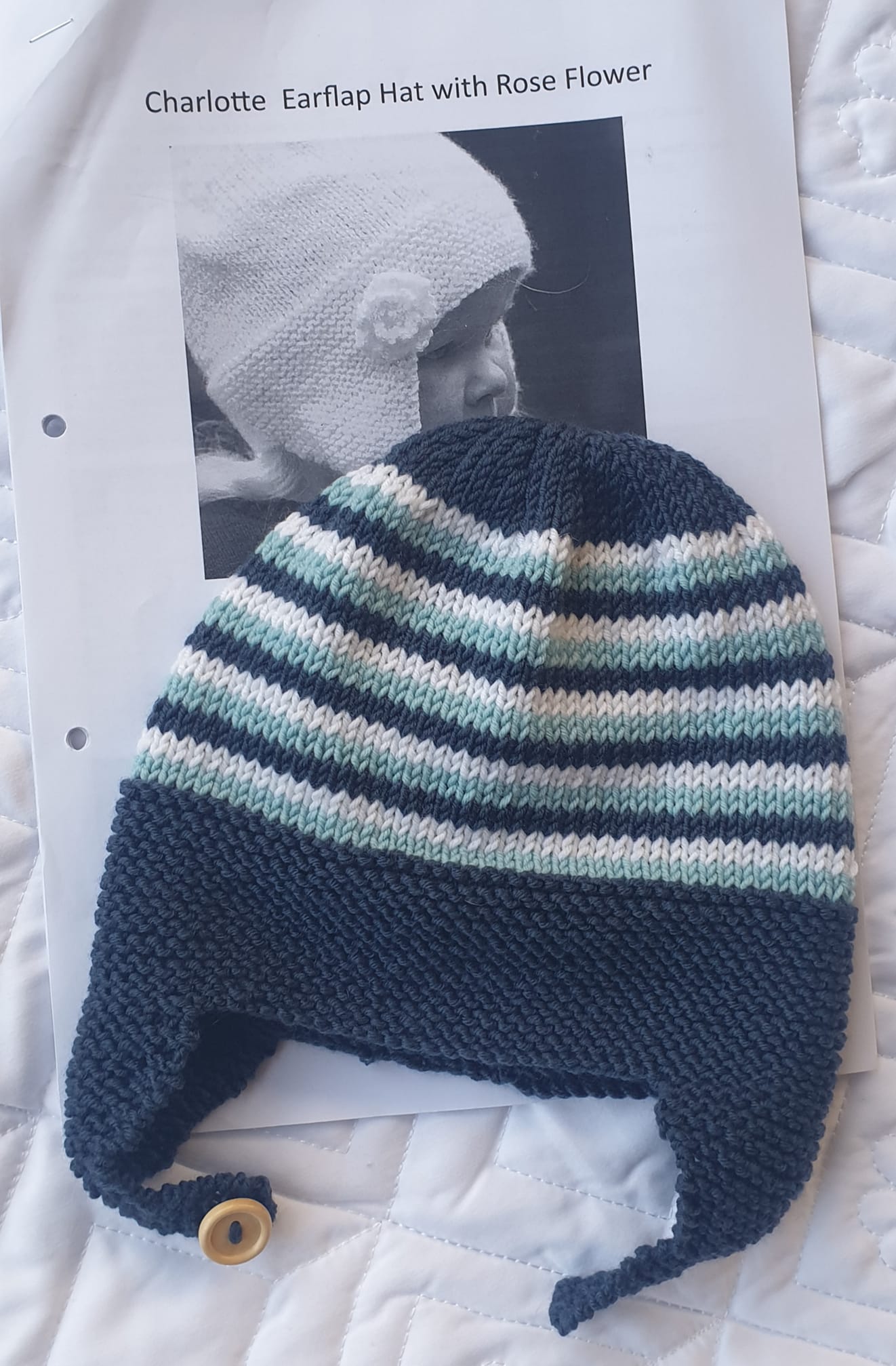 Ear flap hat using scraps of Orb DK merino. Pattern name in the photo.