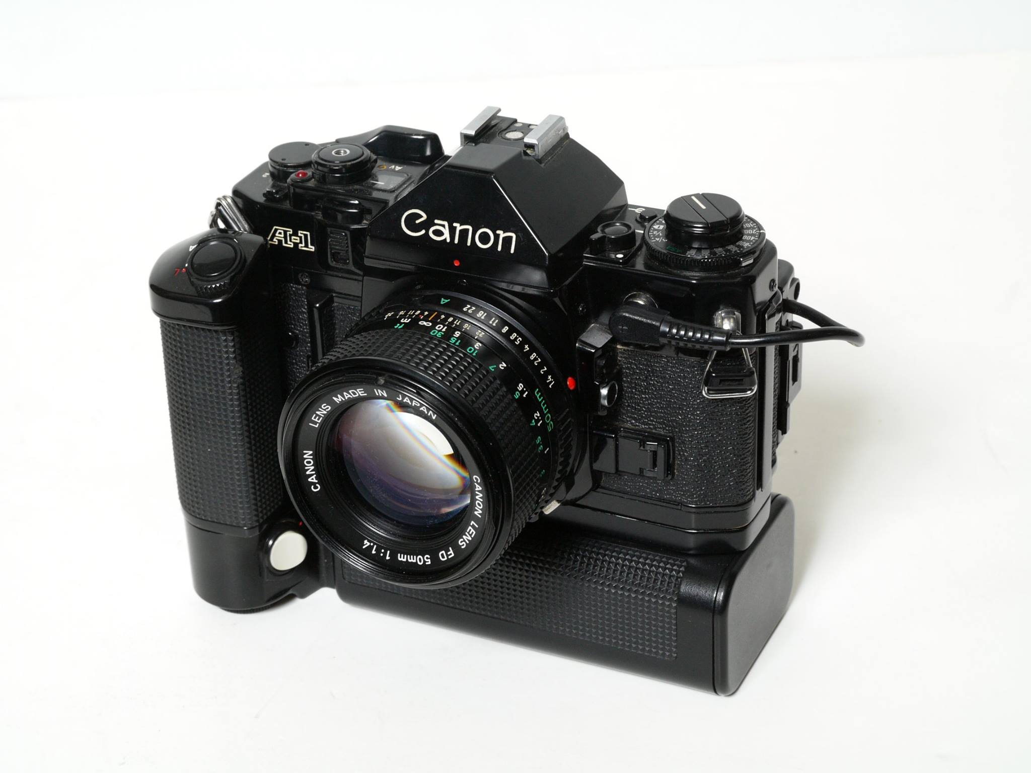 Canon AE-1 35mm film camera with 135mm F/3.5 lens, power winder A.