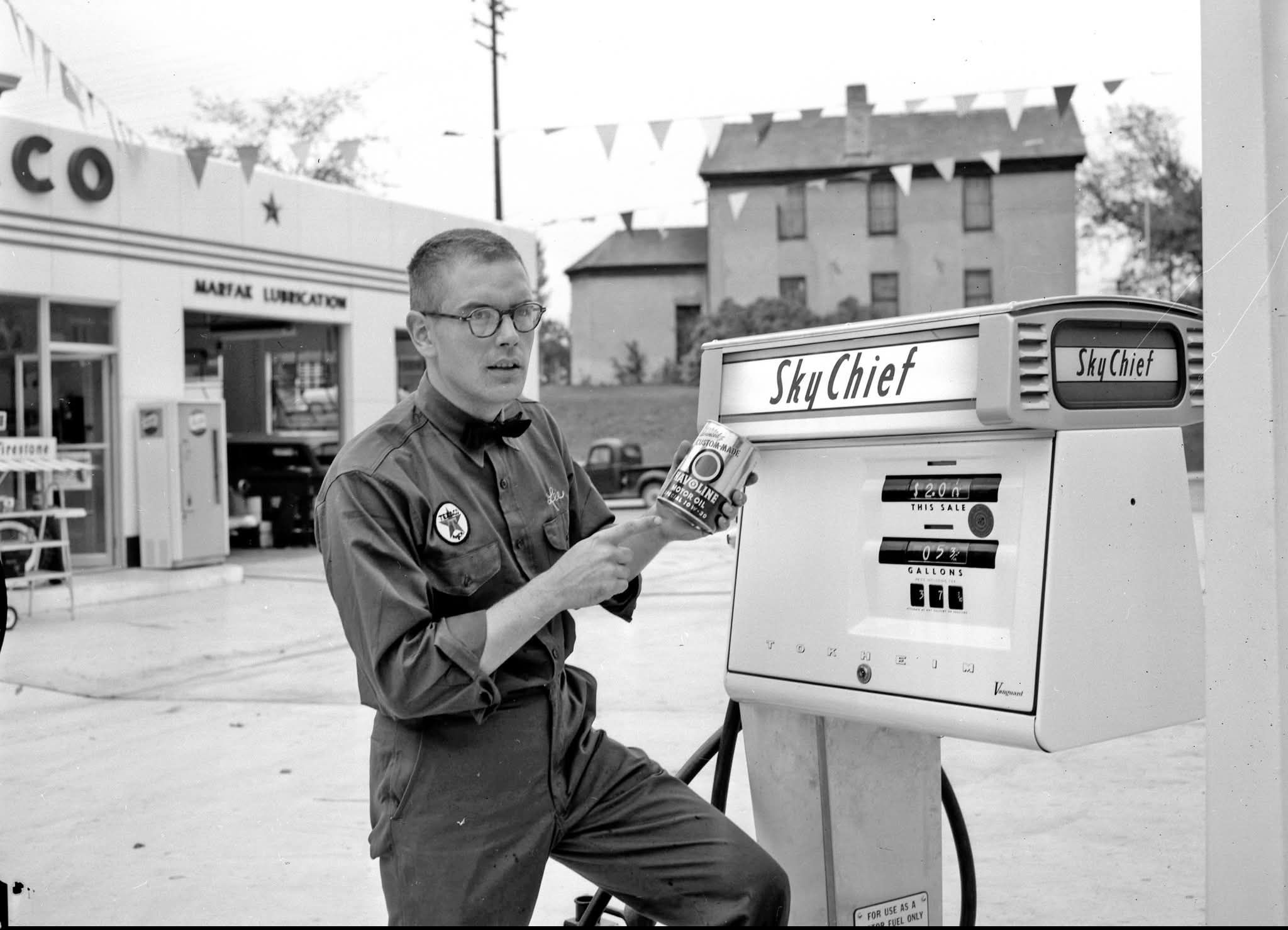 An attendant waits for the next customer at this Phillips 66. On