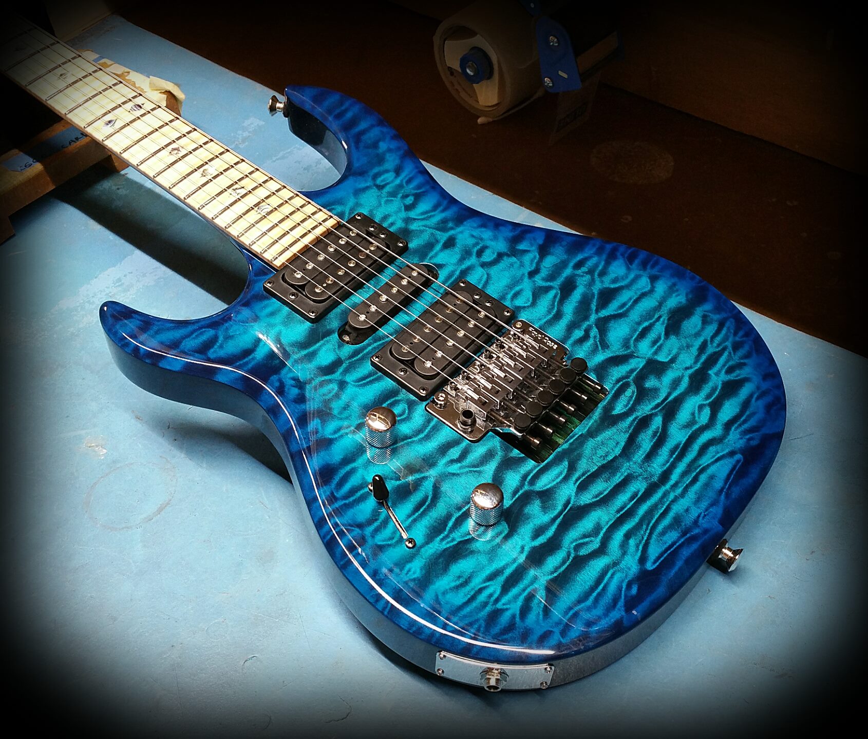 Kiesel - DC127 in deep aquaburst over quilted maple top on black